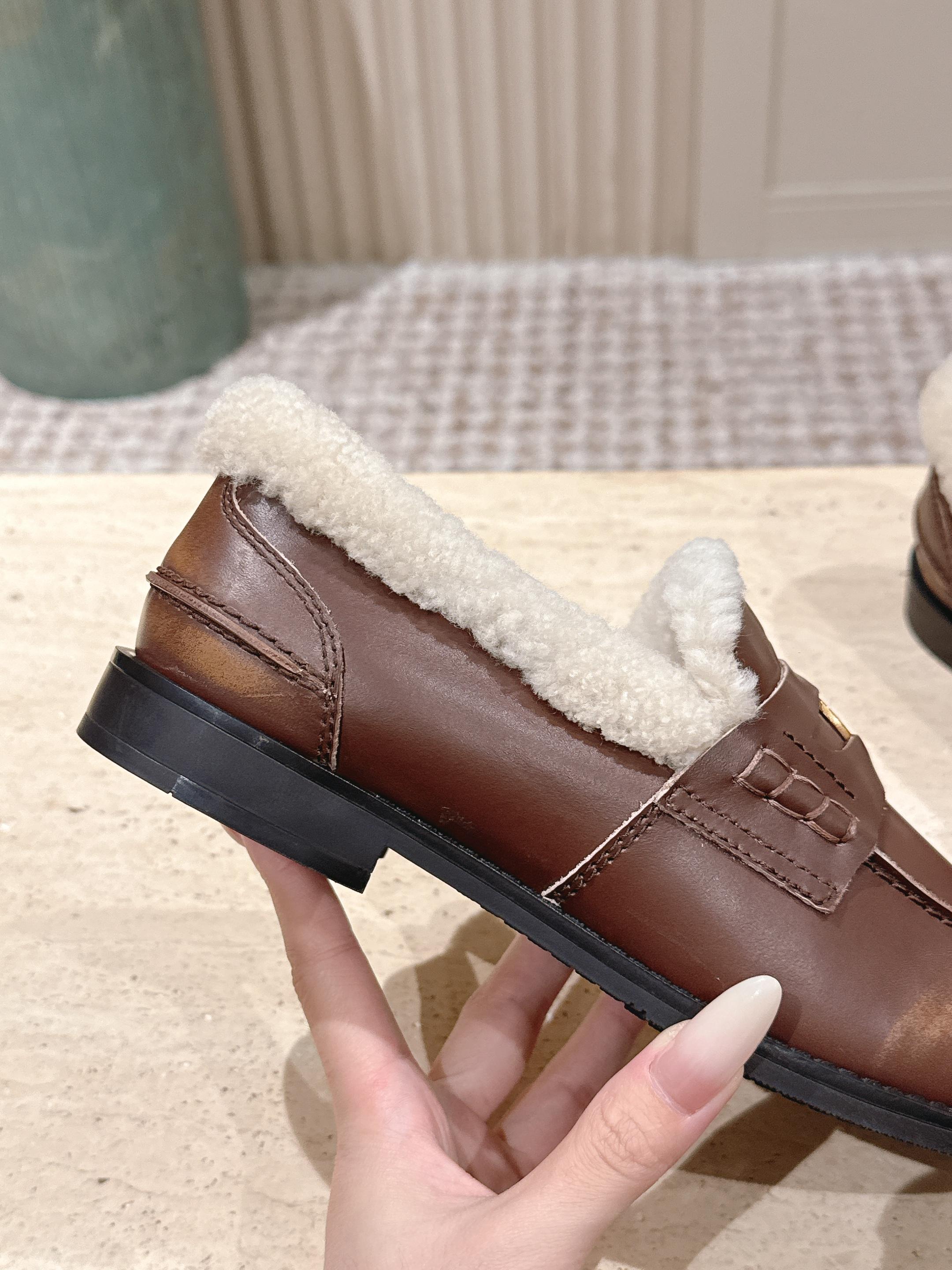 MIUMIU 25S PENNY LOAFERS 20MM IN EBONY BROWN BLEACHED CALFSKIN WITH SHEARLING