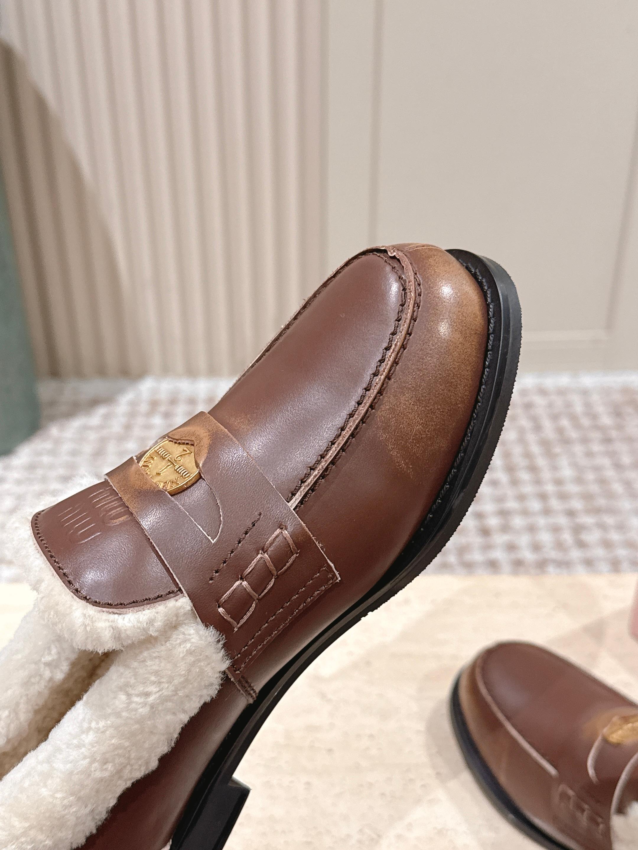 MIUMIU 25S PENNY LOAFERS 20MM IN EBONY BROWN BLEACHED CALFSKIN WITH SHEARLING
