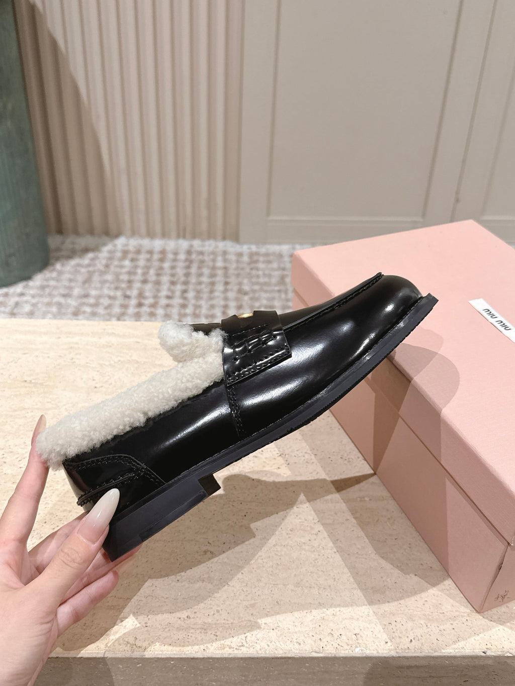 MIUMIU 25S PENNY LOAFERS 20MM IN BLACK PATENT CALFSKIN WITH SHEARLING