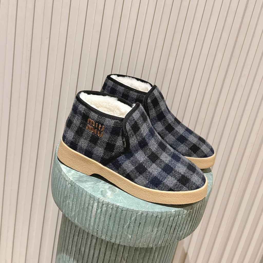 MIUMIU 25S SLIP-ON BOOTIES IN BLACK AND BLUE WOOL WITH SHEARLING