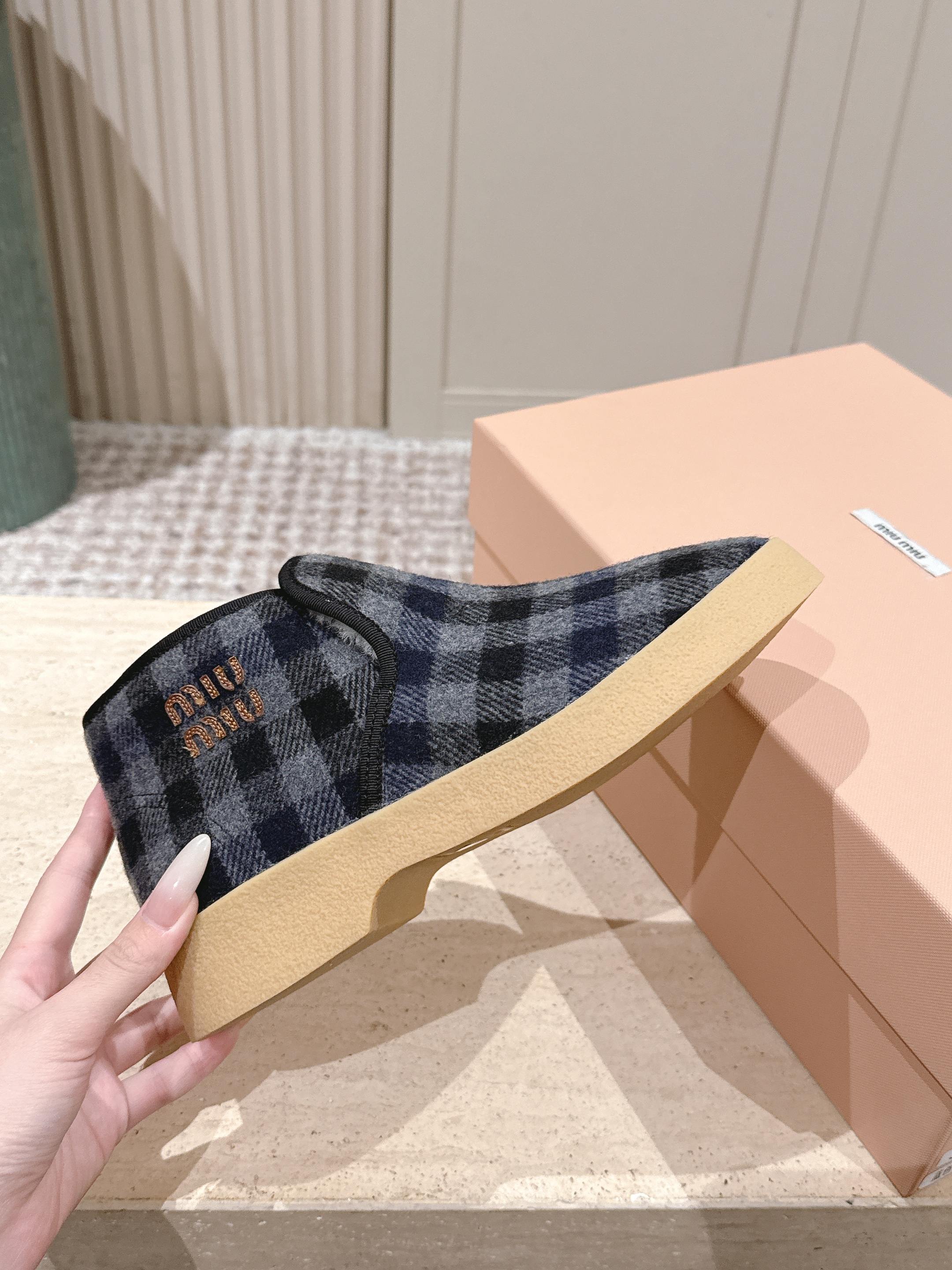 MIUMIU 25S SLIP-ON BOOTIES IN BLACK AND BLUE WOOL WITH SHEARLING