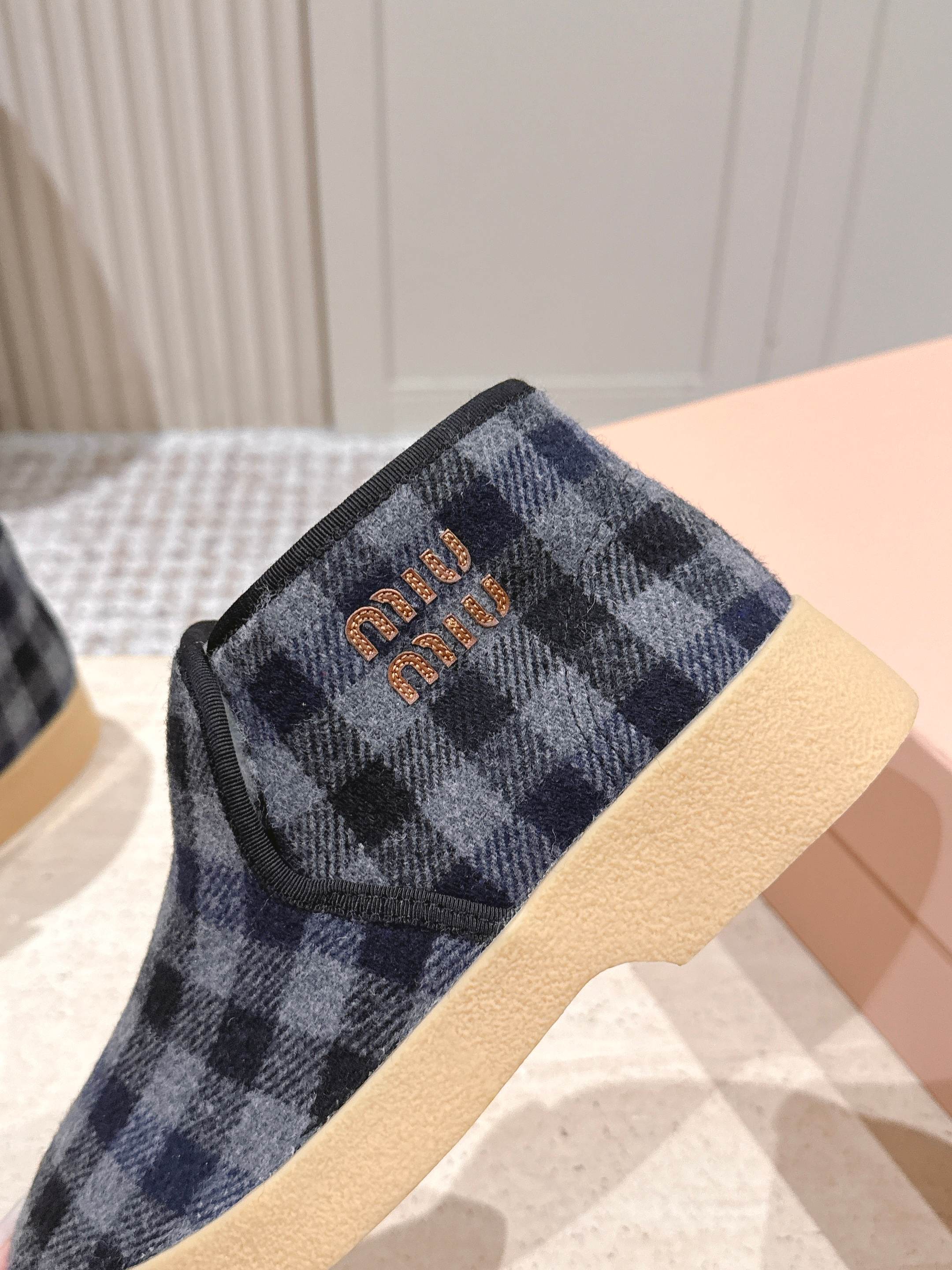 MIUMIU 25S SLIP-ON BOOTIES IN BLACK AND BLUE WOOL WITH SHEARLING