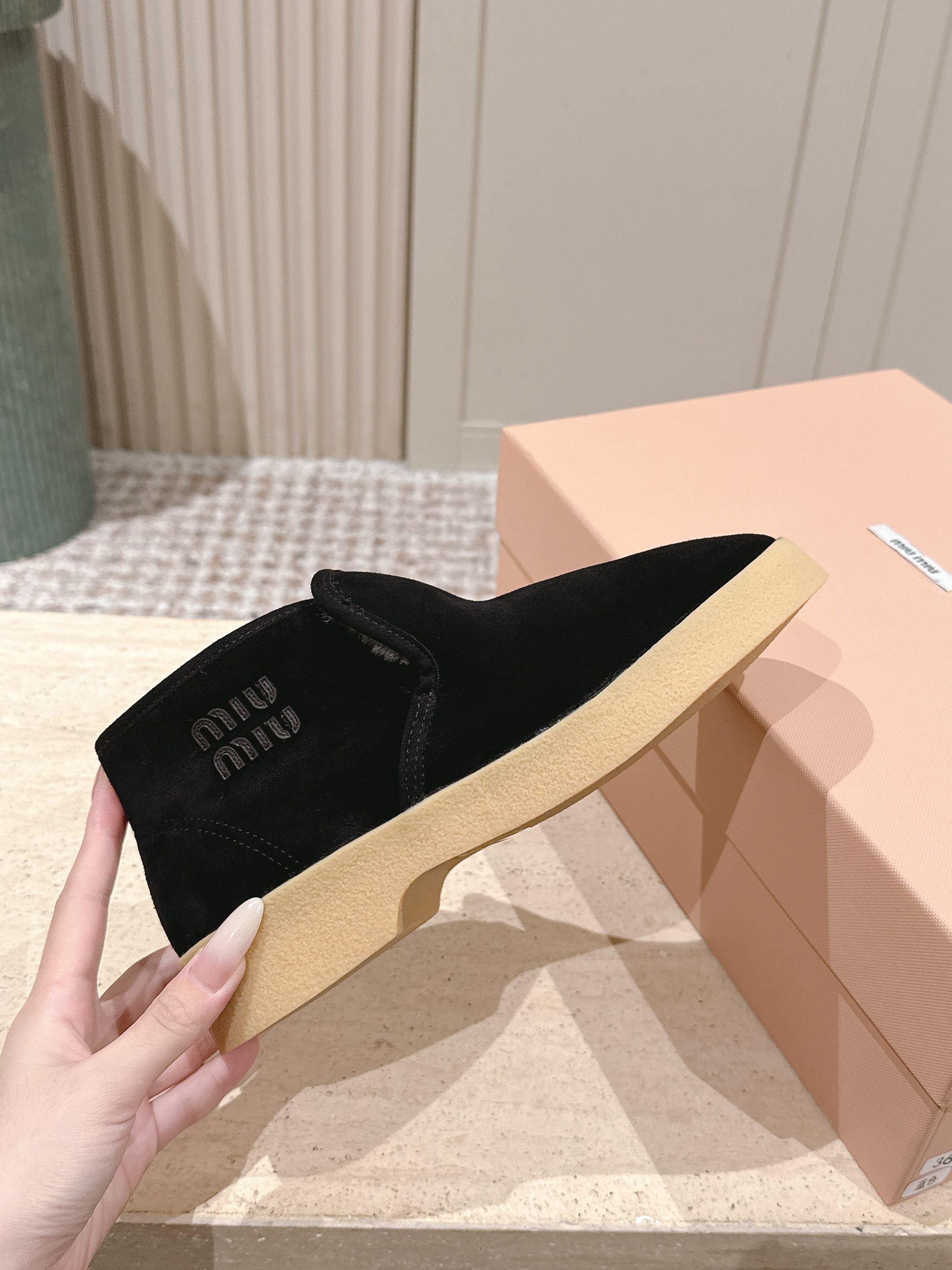 MIUMIU 25S SLIP-ON BOOTIES IN BLACK SUEDE WITH FAUX SHEARLING