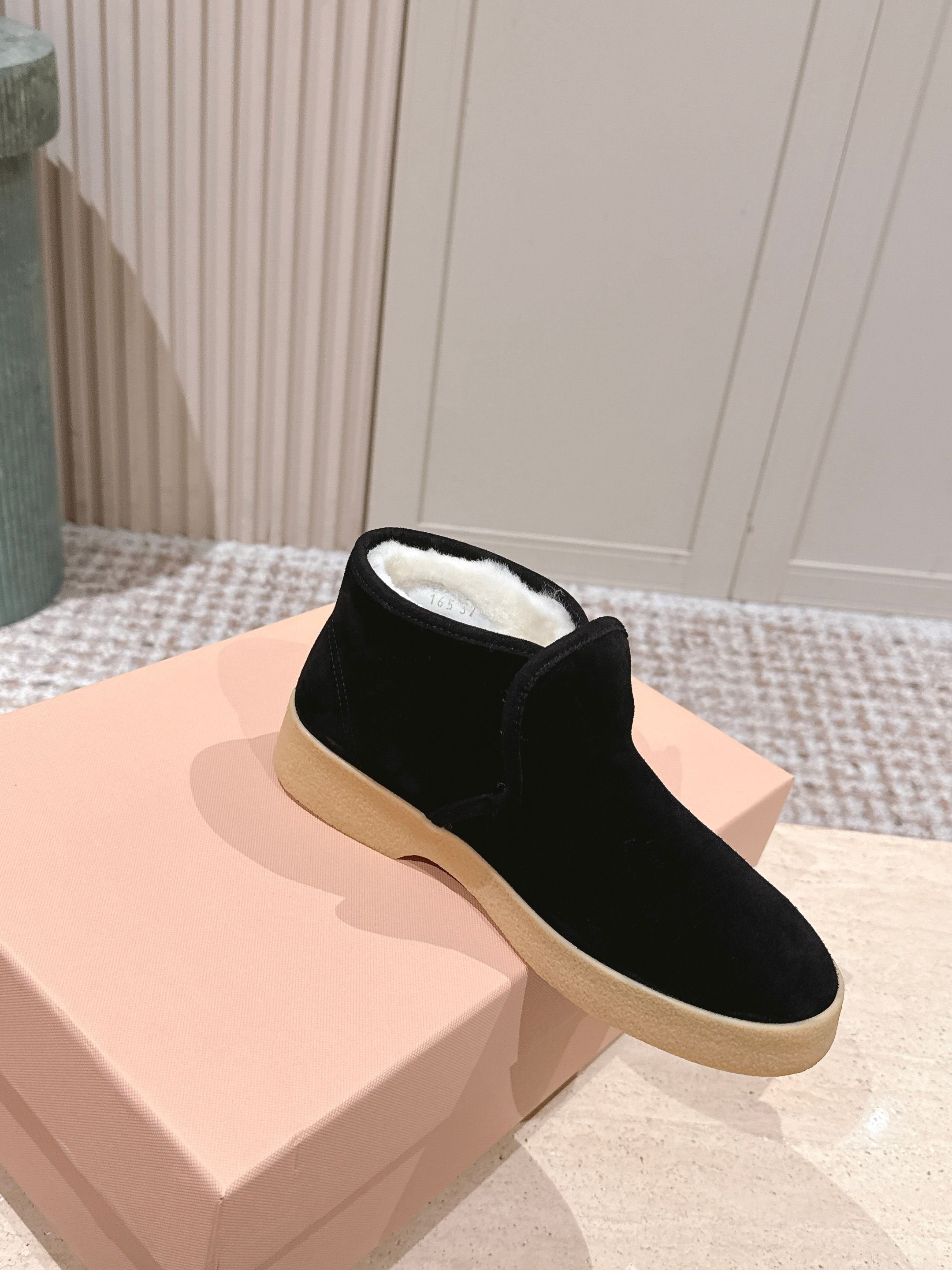 MIUMIU 25S SLIP-ON BOOTIES IN BLACK SUEDE WITH FAUX SHEARLING