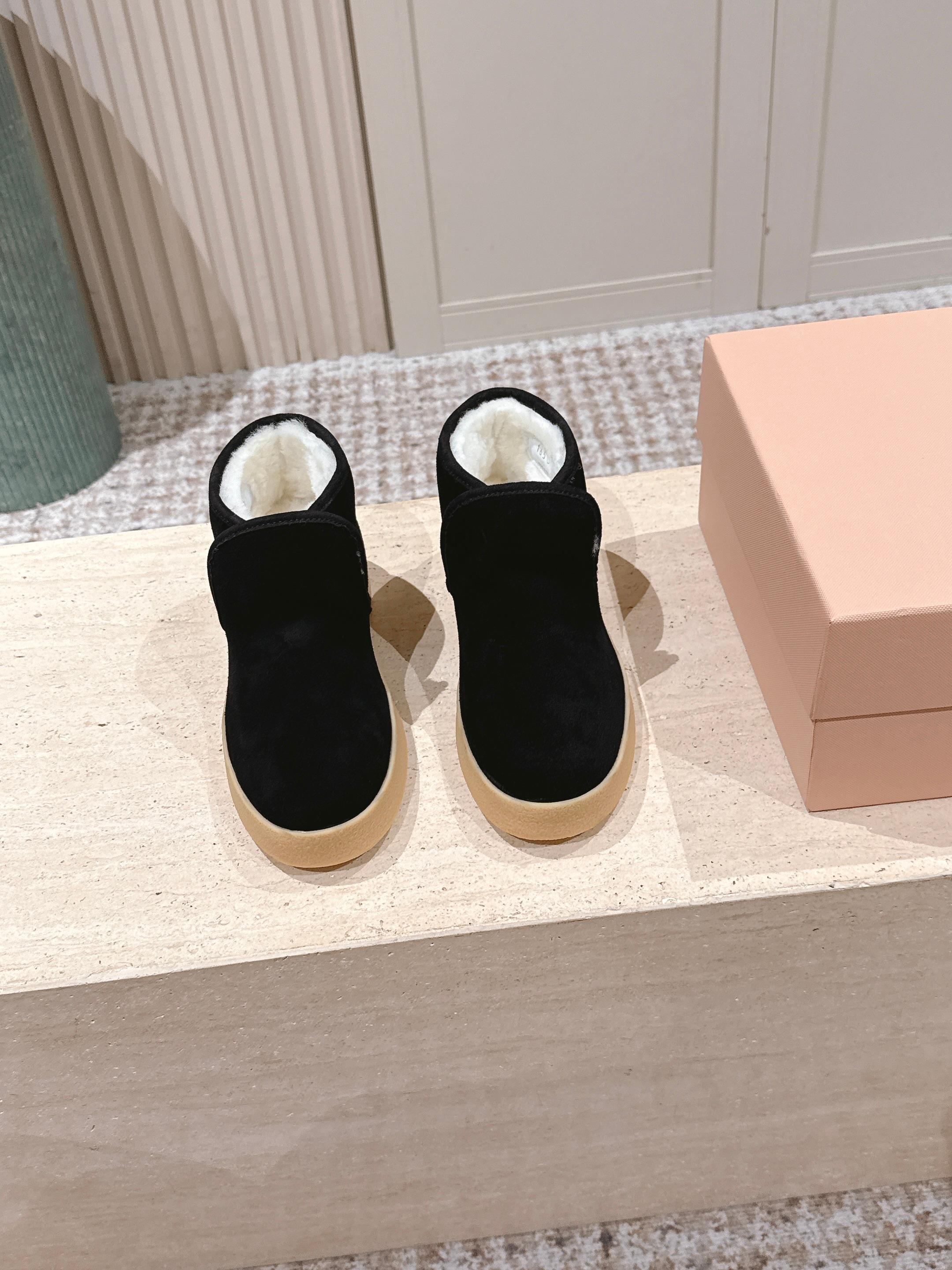 MIUMIU 25S SLIP-ON BOOTIES IN BLACK SUEDE WITH FAUX SHEARLING