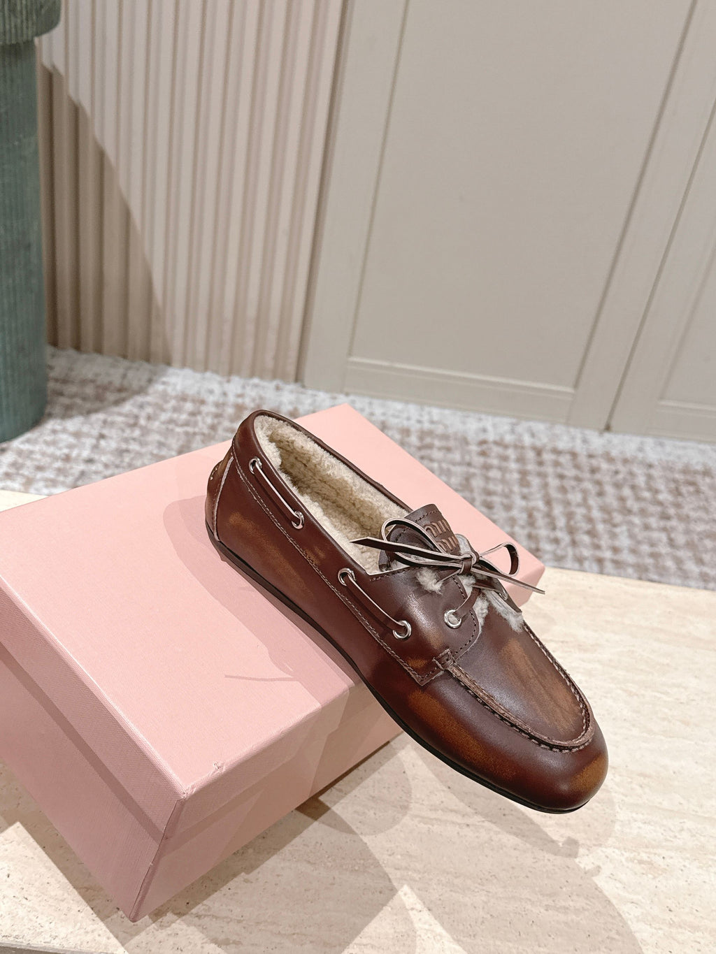 MIUMIU 25S BOAT SHOES IN SIENNA BROWN BLEACHED CALFSKIN WITH SHEARLING