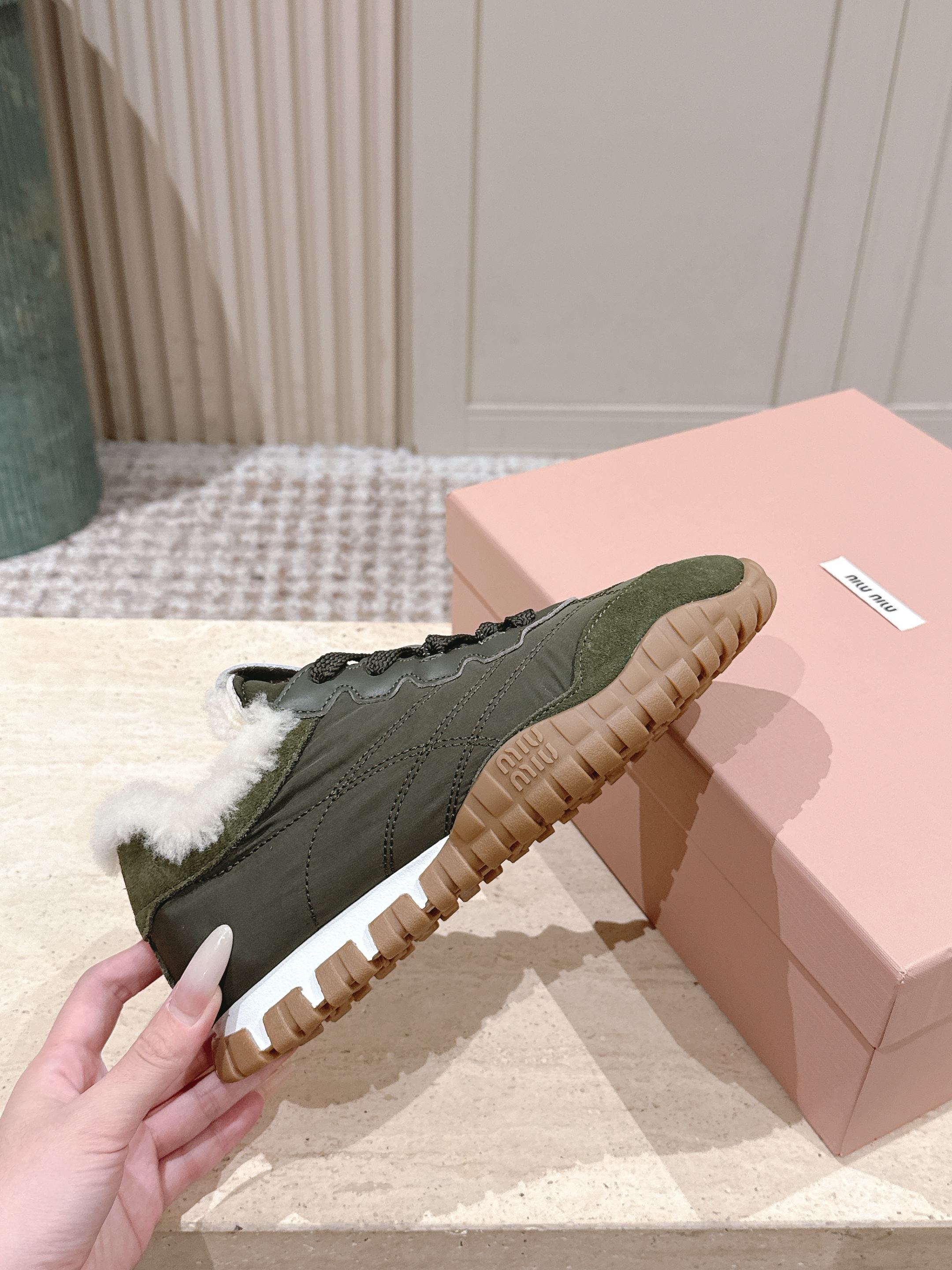MIUMIU 25S SNEAKERS IN LODEN GREEN TYRE TECHNICAL FABRIC AND SUEDE SHEARLING