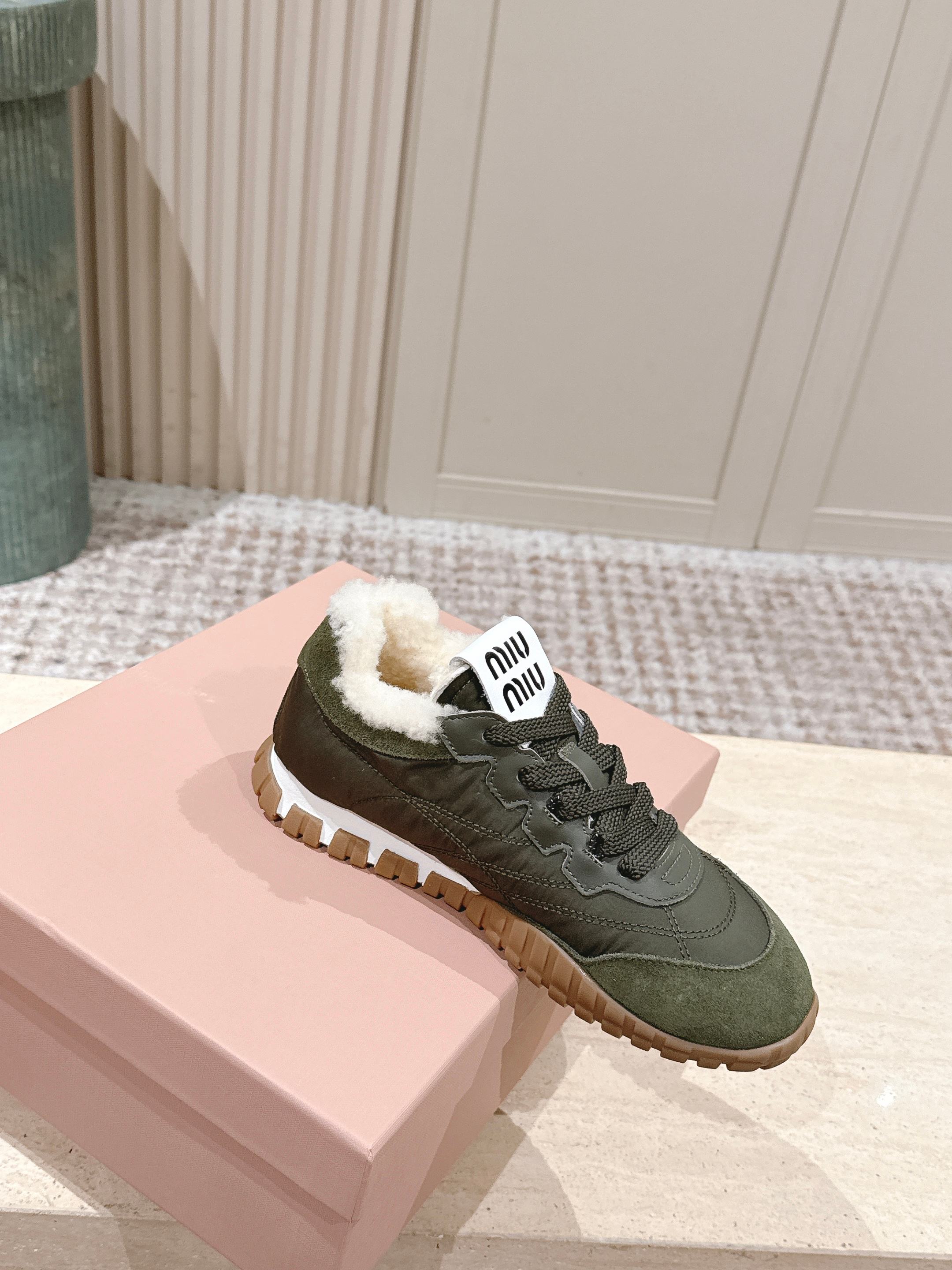 MIUMIU 25S SNEAKERS IN LODEN GREEN TYRE TECHNICAL FABRIC AND SUEDE SHEARLING