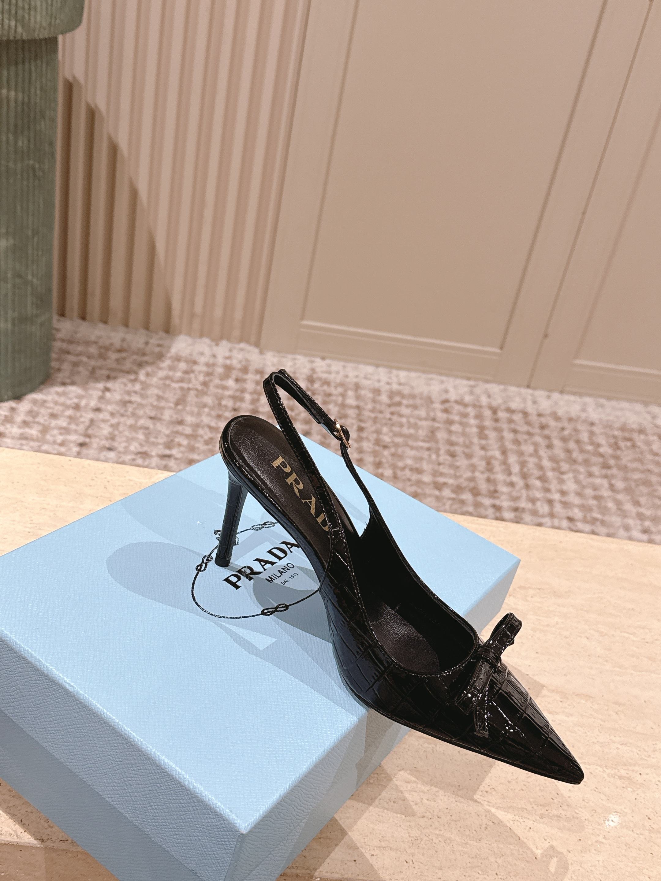 PRADA 26S POINTED-TOE SLINGBACK HEELS 85MM IN BLACK CROC-EMBOSSED CALFSKIN