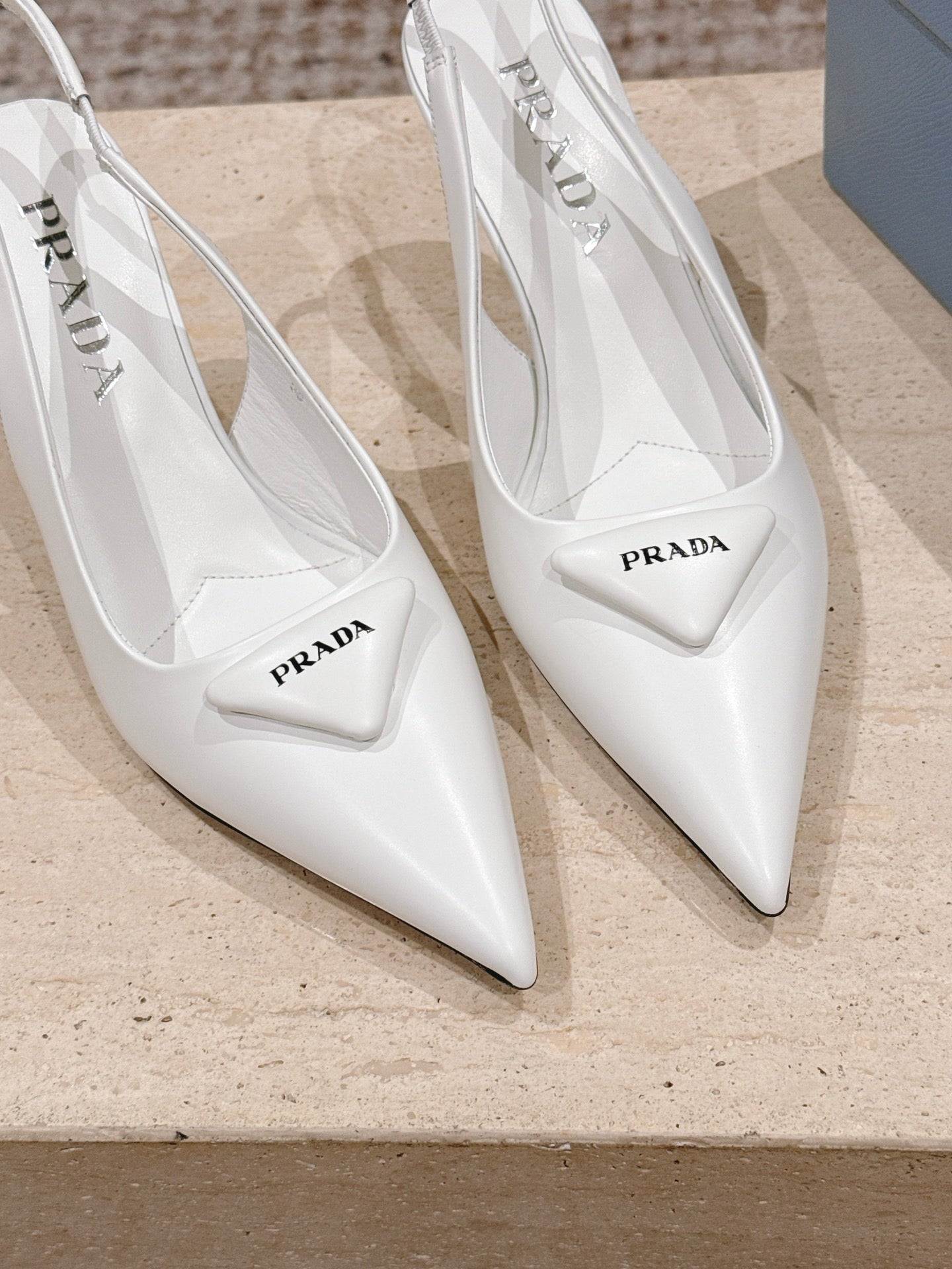 PRADA 26S POINTED-TOE SLINGBACK HEELS 75MM IN WHITE SHINY CALFSKIN
