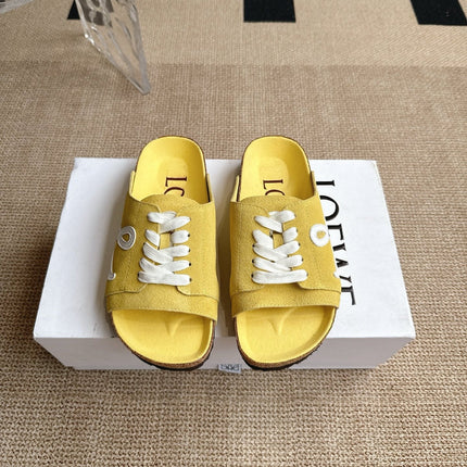 LOEWE 26S LACE-UP FLAT SLIDES IN YELLOW SUEDE