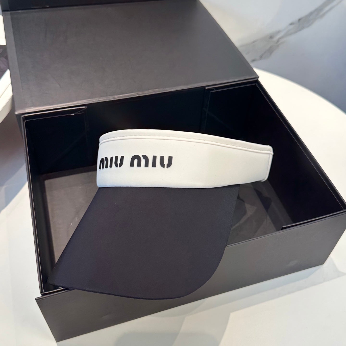 MIUMIU SPORT VISOR CAP IN BLACK MIX WHITE FABRIC