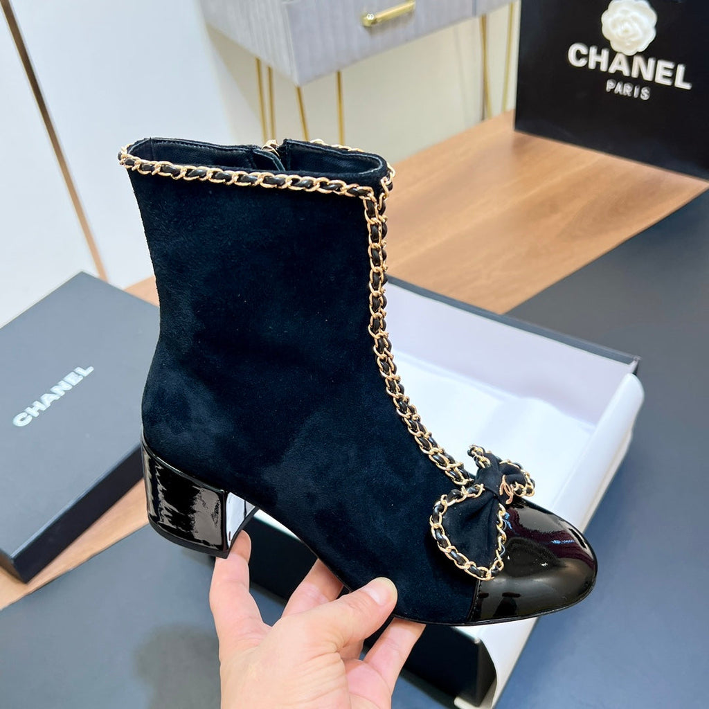 CHANEL 25S HEELED CHAIN BOOTS WITH BOW IN BLACK VELVET GOLD HARDWARE