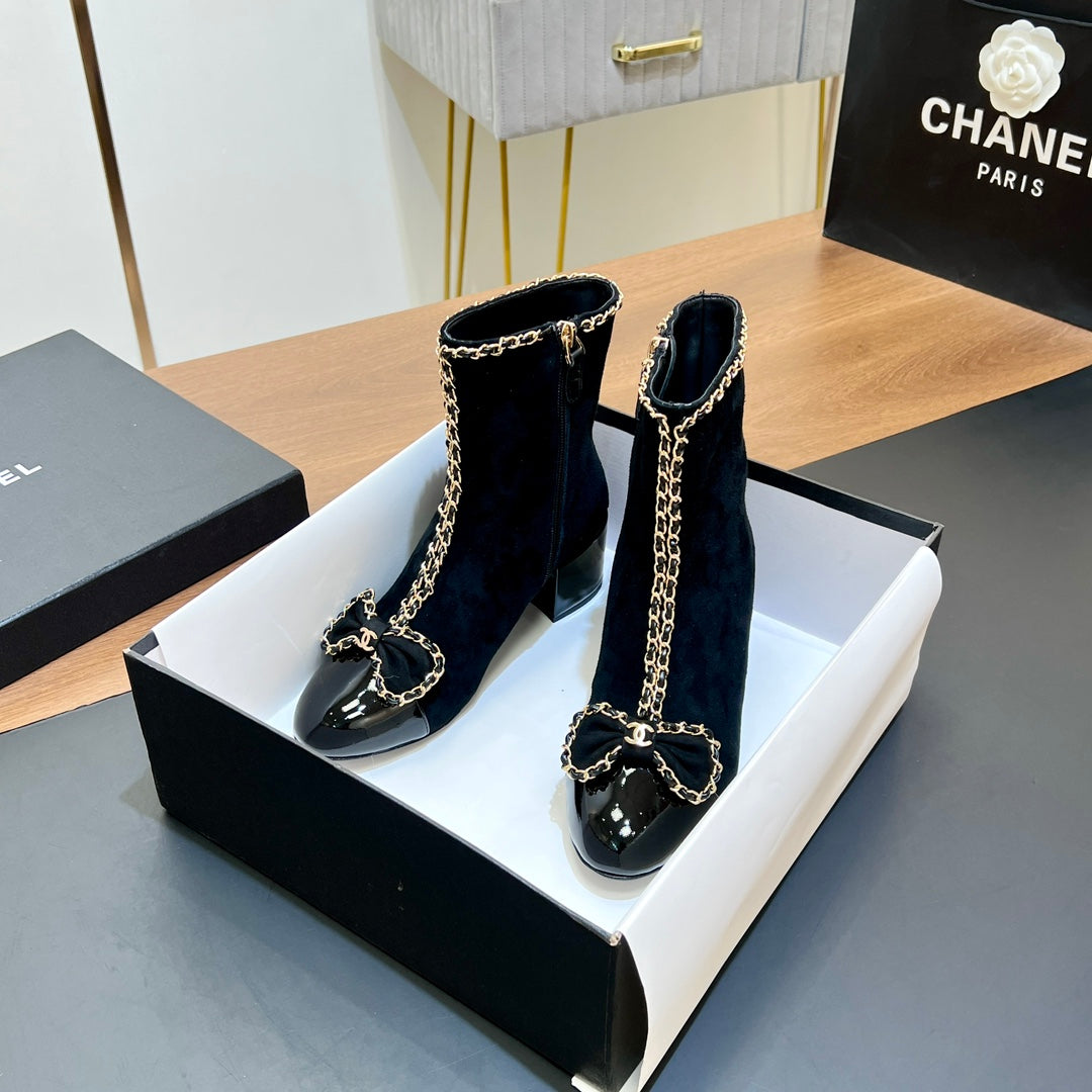 CHANEL 25S HEELED CHAIN BOOTS WITH BOW IN BLACK VELVET GOLD HARDWARE