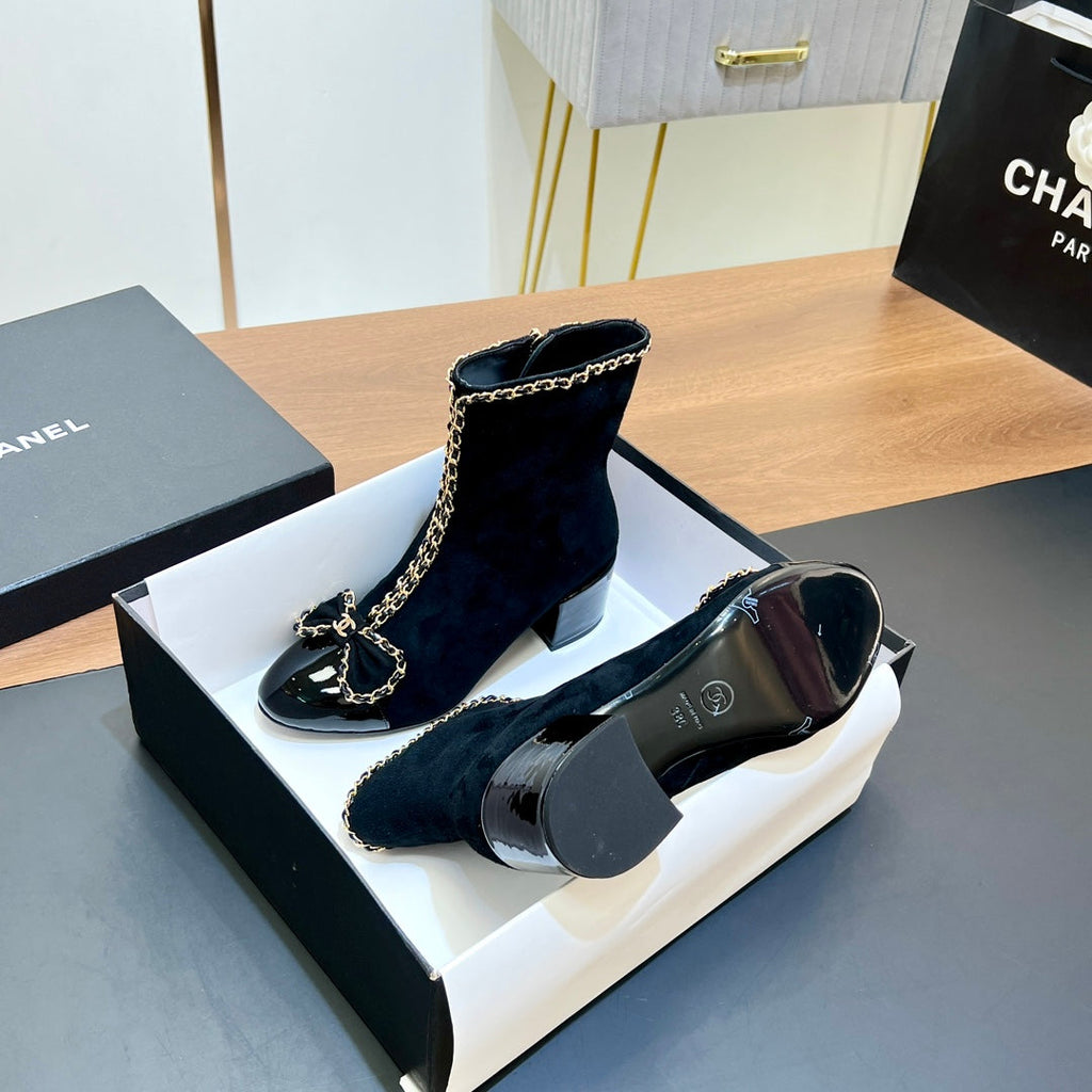 CHANEL 25S HEELED CHAIN BOOTS WITH BOW IN BLACK VELVET GOLD HARDWARE