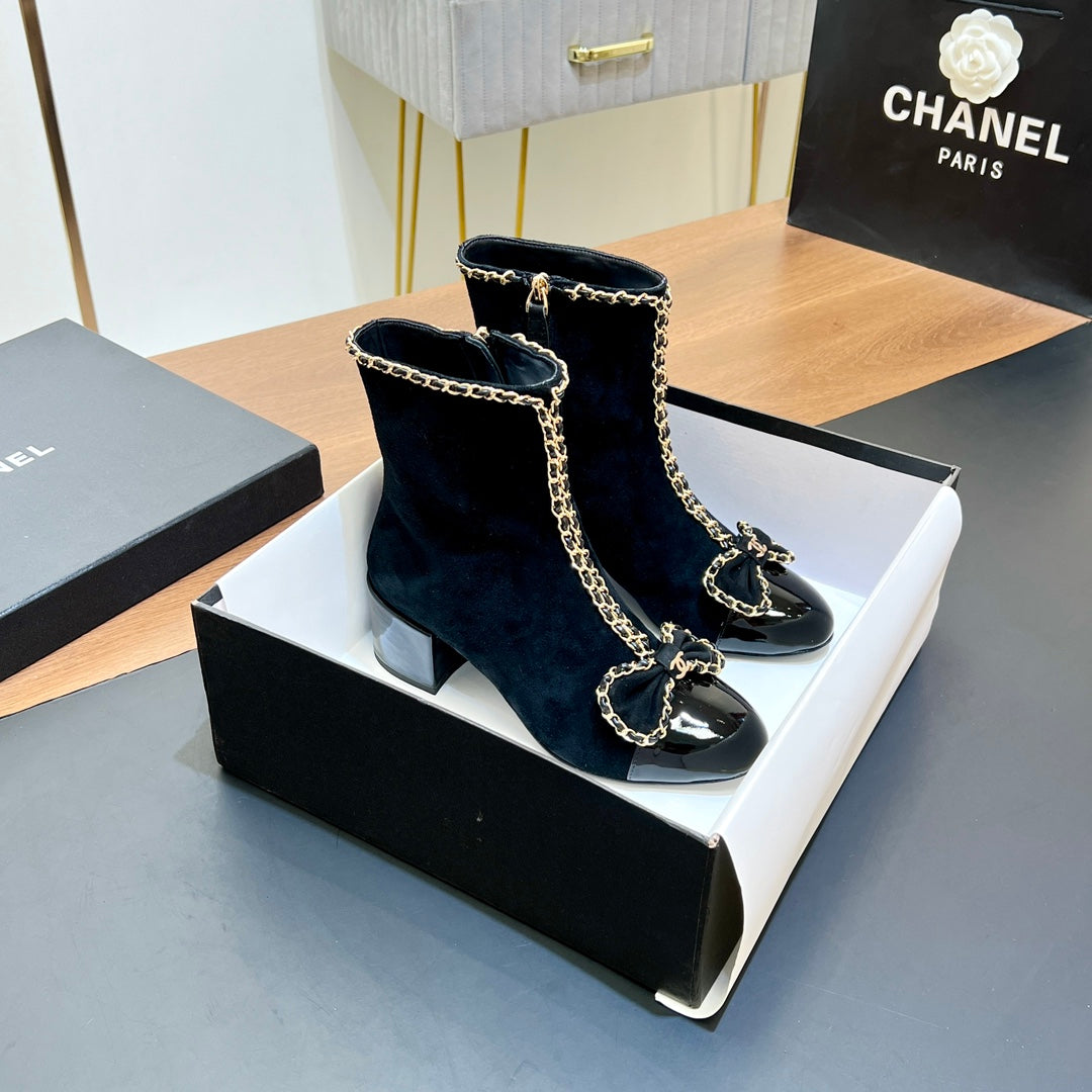 CHANEL 25S HEELED CHAIN BOOTS WITH BOW IN BLACK VELVET GOLD HARDWARE