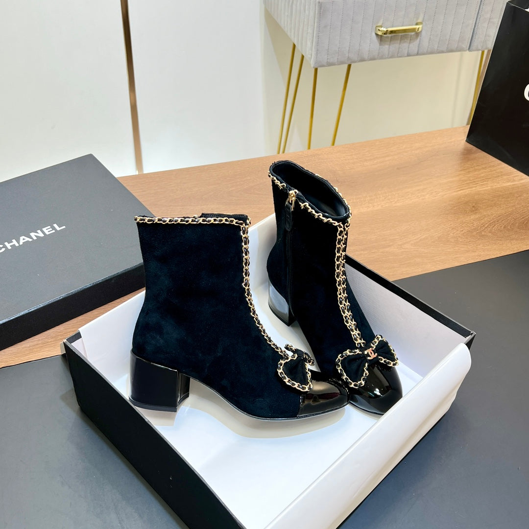 CHANEL 25S HEELED CHAIN BOOTS WITH BOW IN BLACK VELVET GOLD HARDWARE