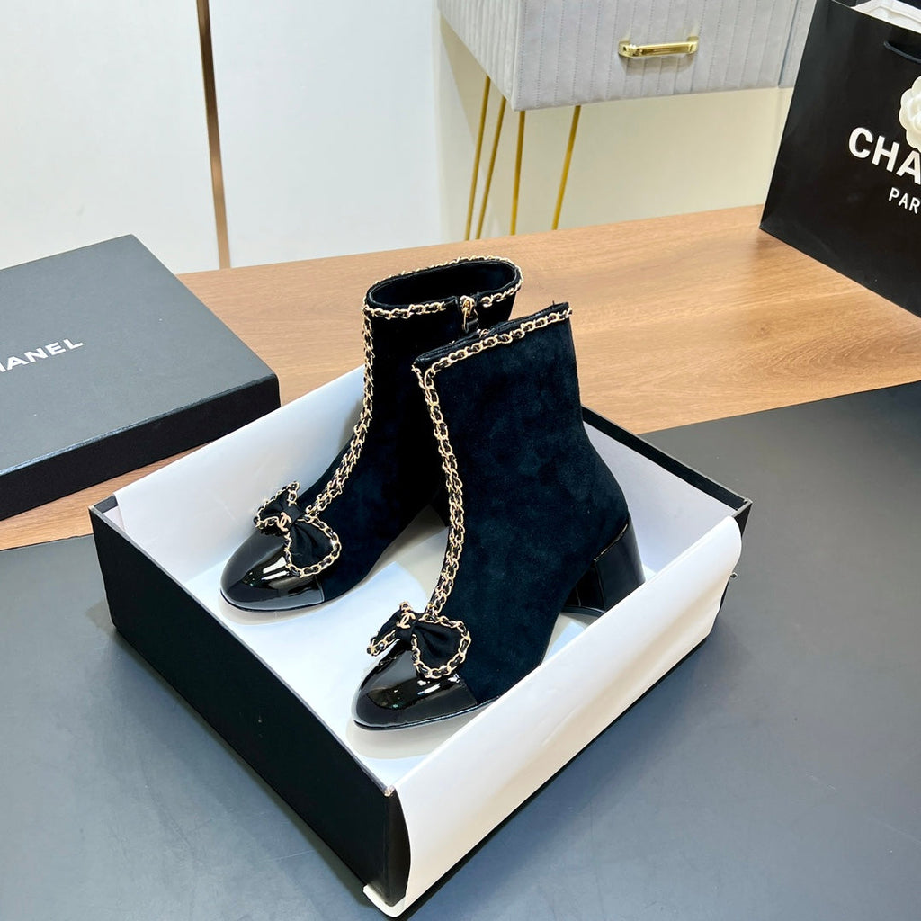 CHANEL 25S HEELED CHAIN BOOTS WITH BOW IN BLACK VELVET GOLD HARDWARE