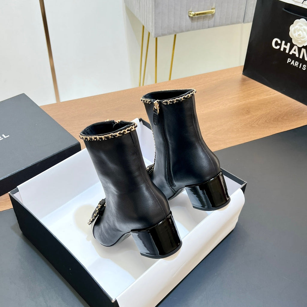 CHANEL 25S HEELED CHAIN BOOTS WITH BOW IN BLACK CALFSKIN GOLD HARDWARE