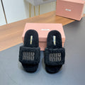 SLIPPERS IN BLACK LAMB WOOL