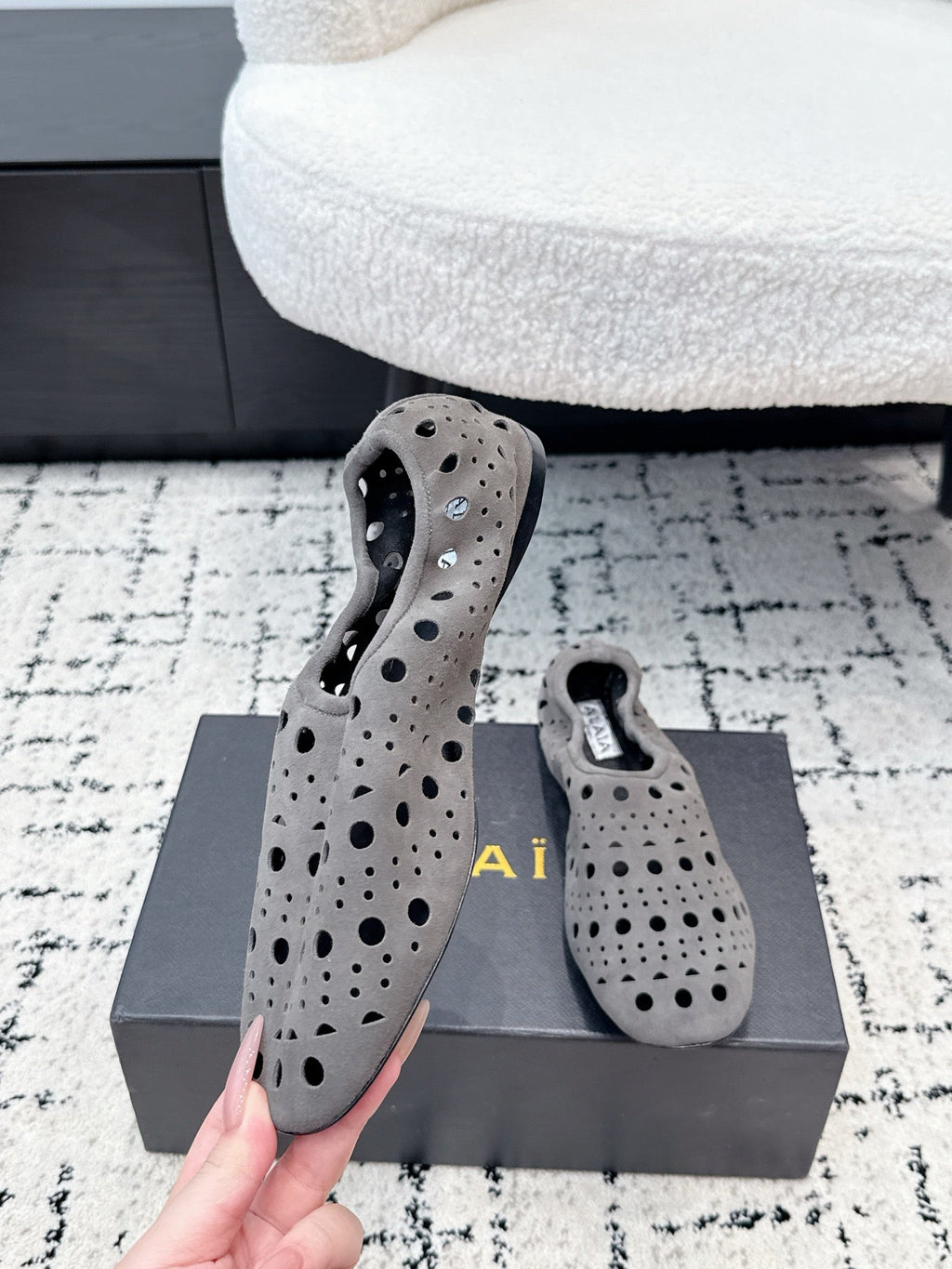 ALAIA 26S FLAT SLIP-ONS IN GREY SUEDE WITH OPENWORK PATTERN