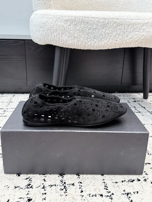 ALAIA 26S FLAT SLIP-ONS IN BLACK SUEDE WITH OPENWORK PATTERN