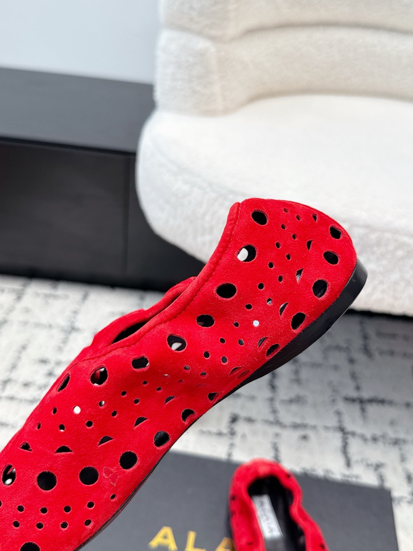 ALAIA 26S FLAT SLIP-ONS IN RED SUEDE WITH OPENWORK PATTERN