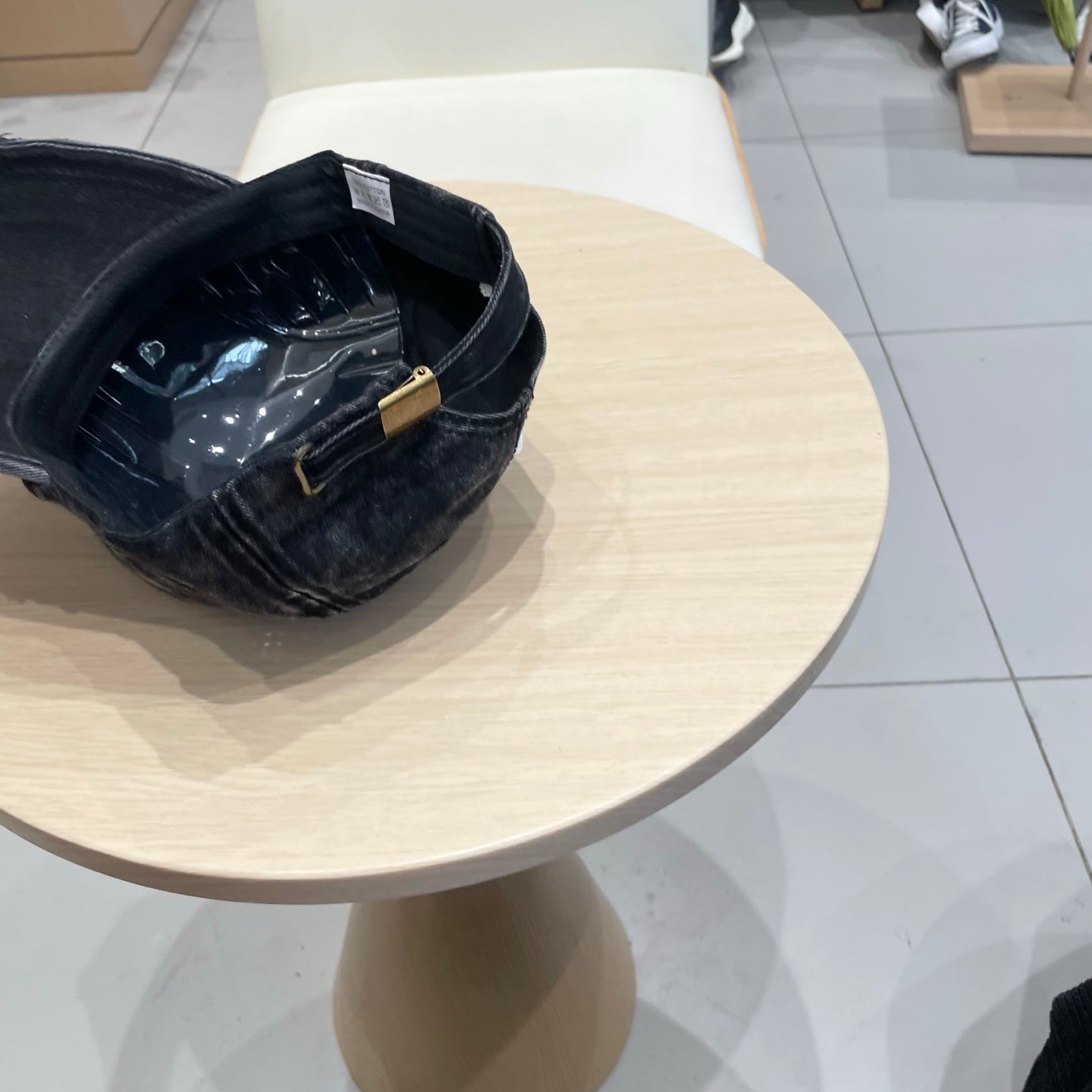 MIUMIU DISTRESSED FABRIC BASEBALL CAP IN BLACK WITH EMBROIDERED LOGO