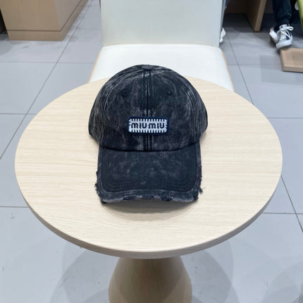 MIUMIU DISTRESSED FABRIC BASEBALL CAP IN BLACK WITH EMBROIDERED LOGO