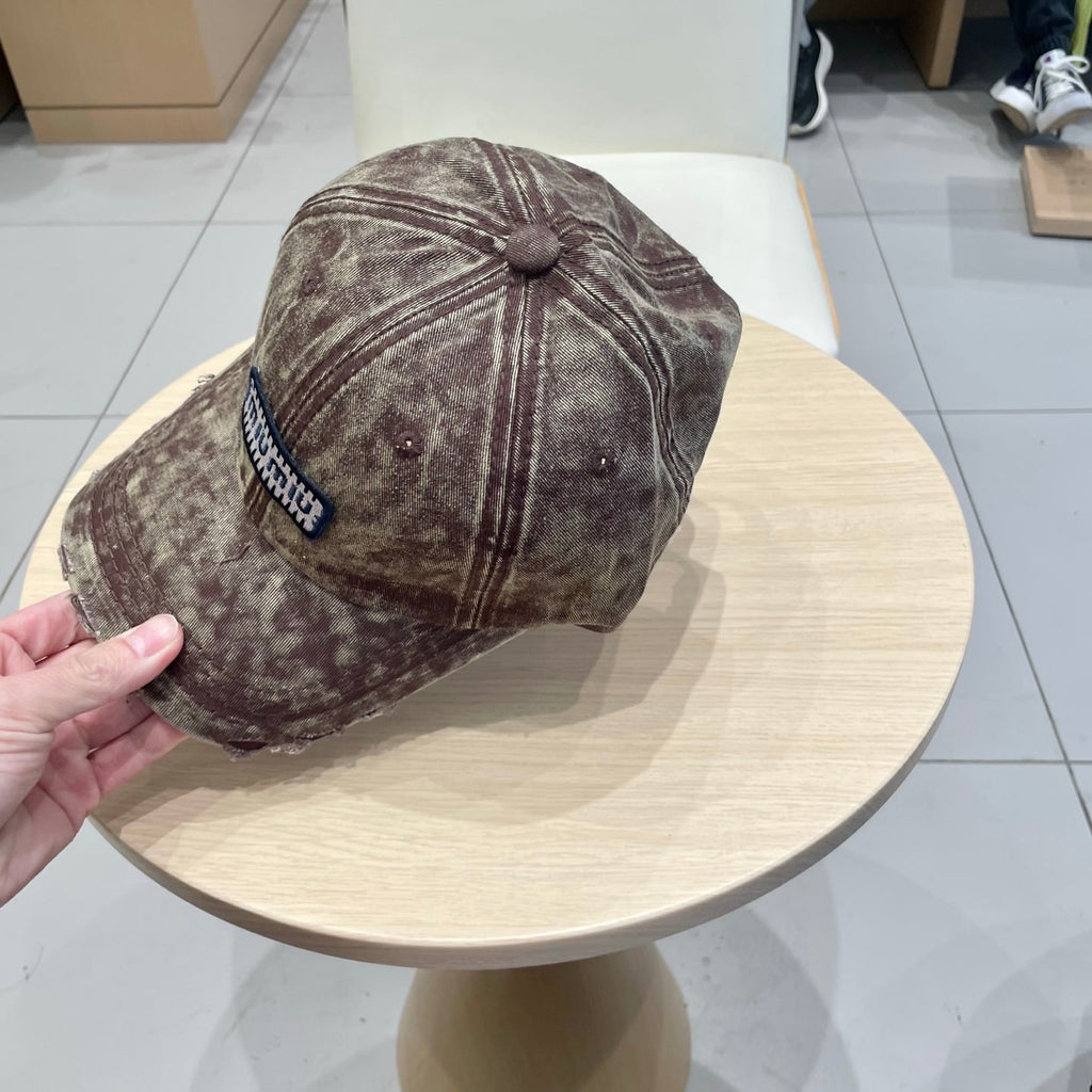 MIUMIU DISTRESSED FABRIC BASEBALL CAP IN BROWN WITH EMBROIDERED LOGO