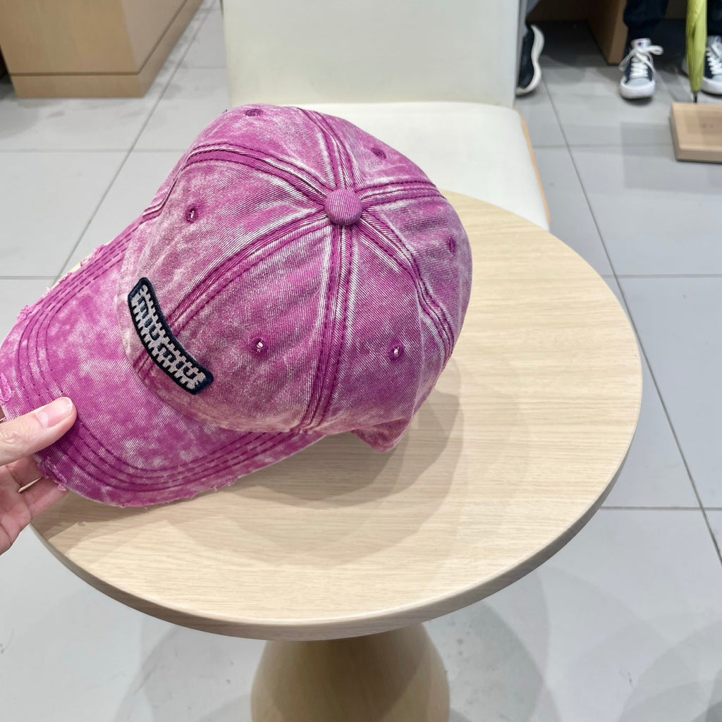 MIUMIU DISTRESSED FABRIC BASEBALL CAP IN PINK WITH EMBROIDERED LOGO