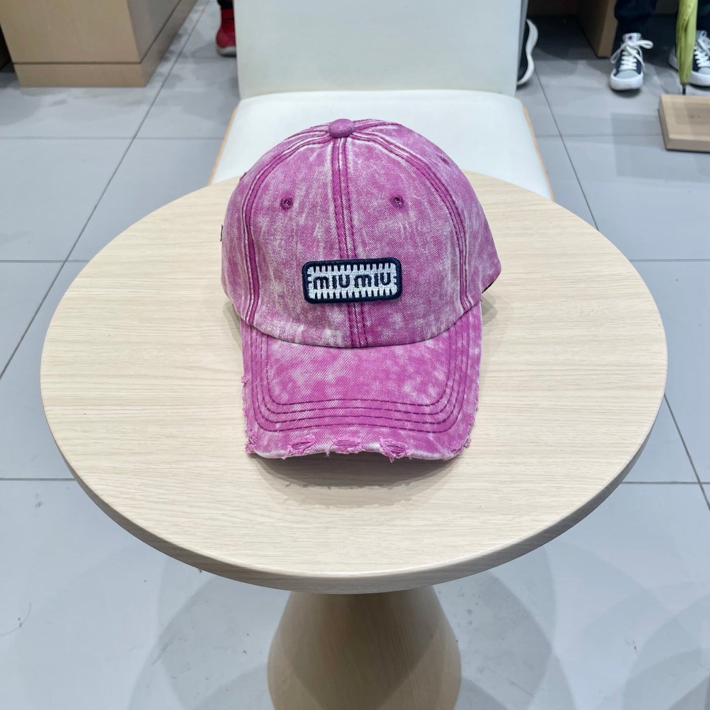 MIUMIU DISTRESSED FABRIC BASEBALL CAP IN PINK WITH EMBROIDERED LOGO
