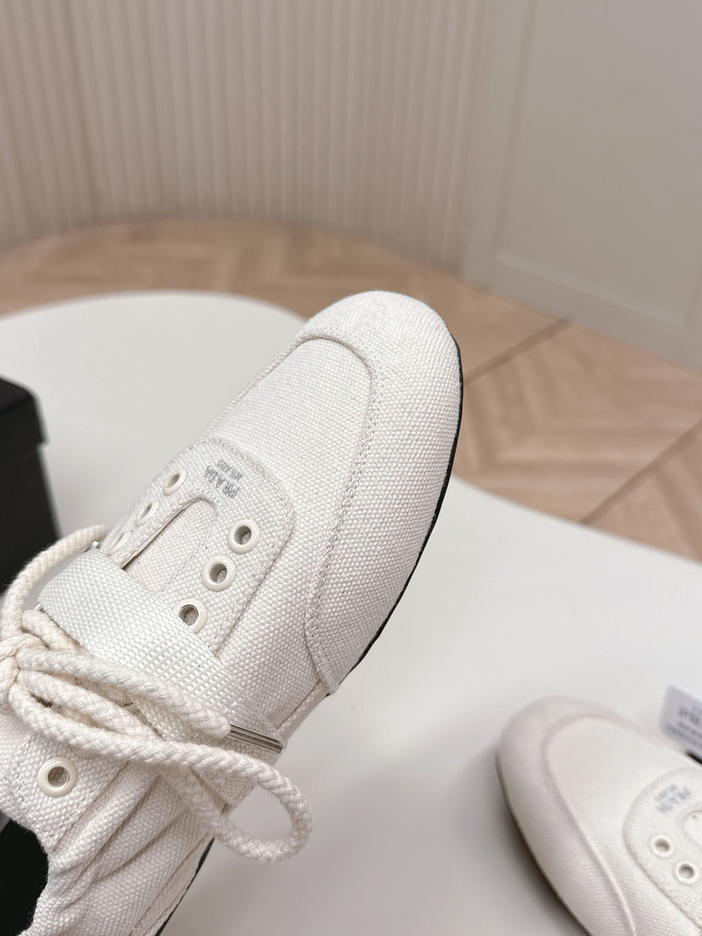 PRADA 26S LACE UP MINIMAL SNEAKERS IN WHITE CANVAS