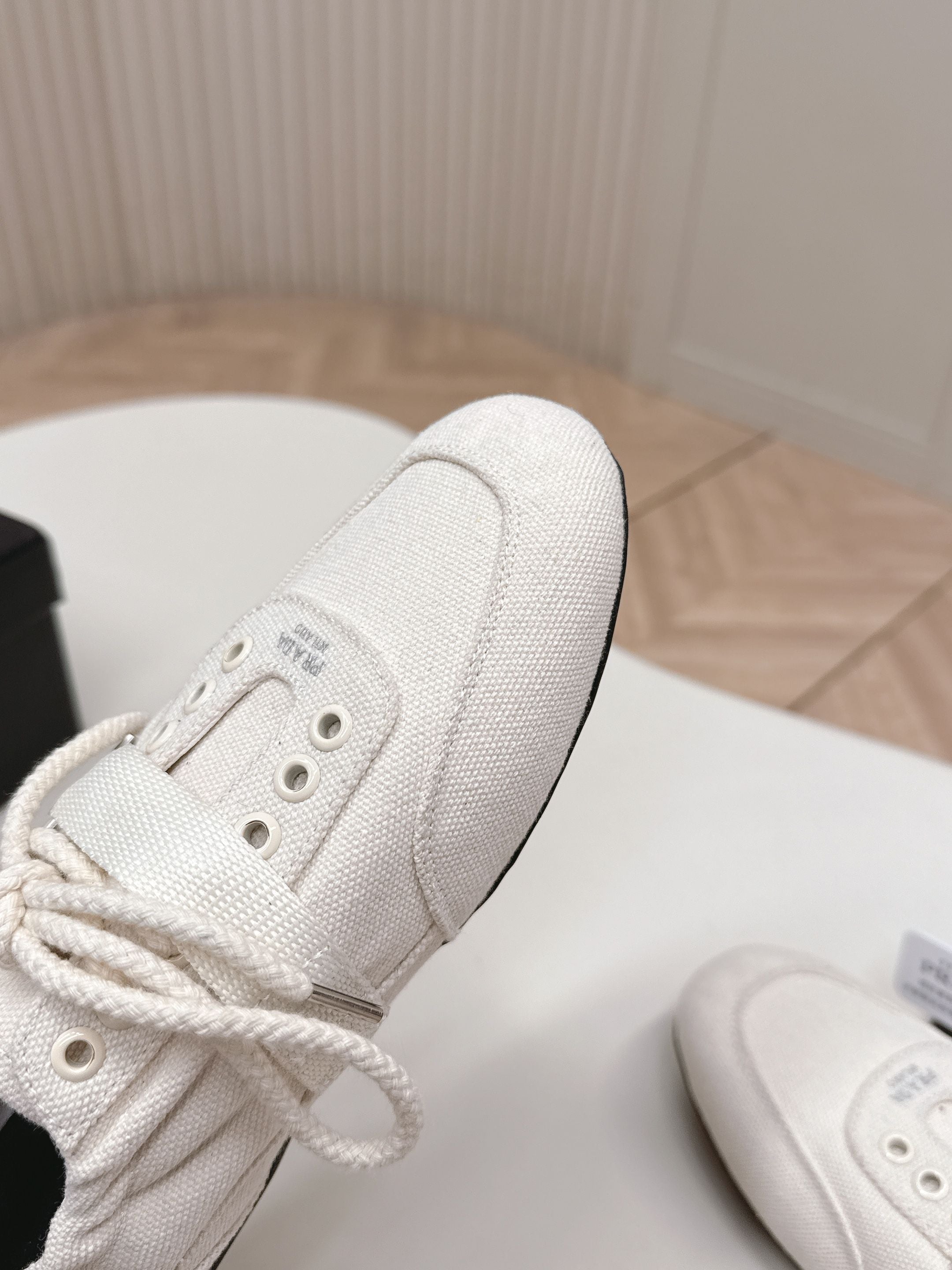 PRADA 26S LACE UP MINIMAL SNEAKERS IN WHITE CANVAS