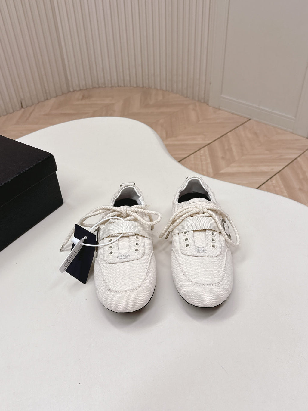 PRADA 26S LACE UP MINIMAL SNEAKERS IN WHITE CANVAS