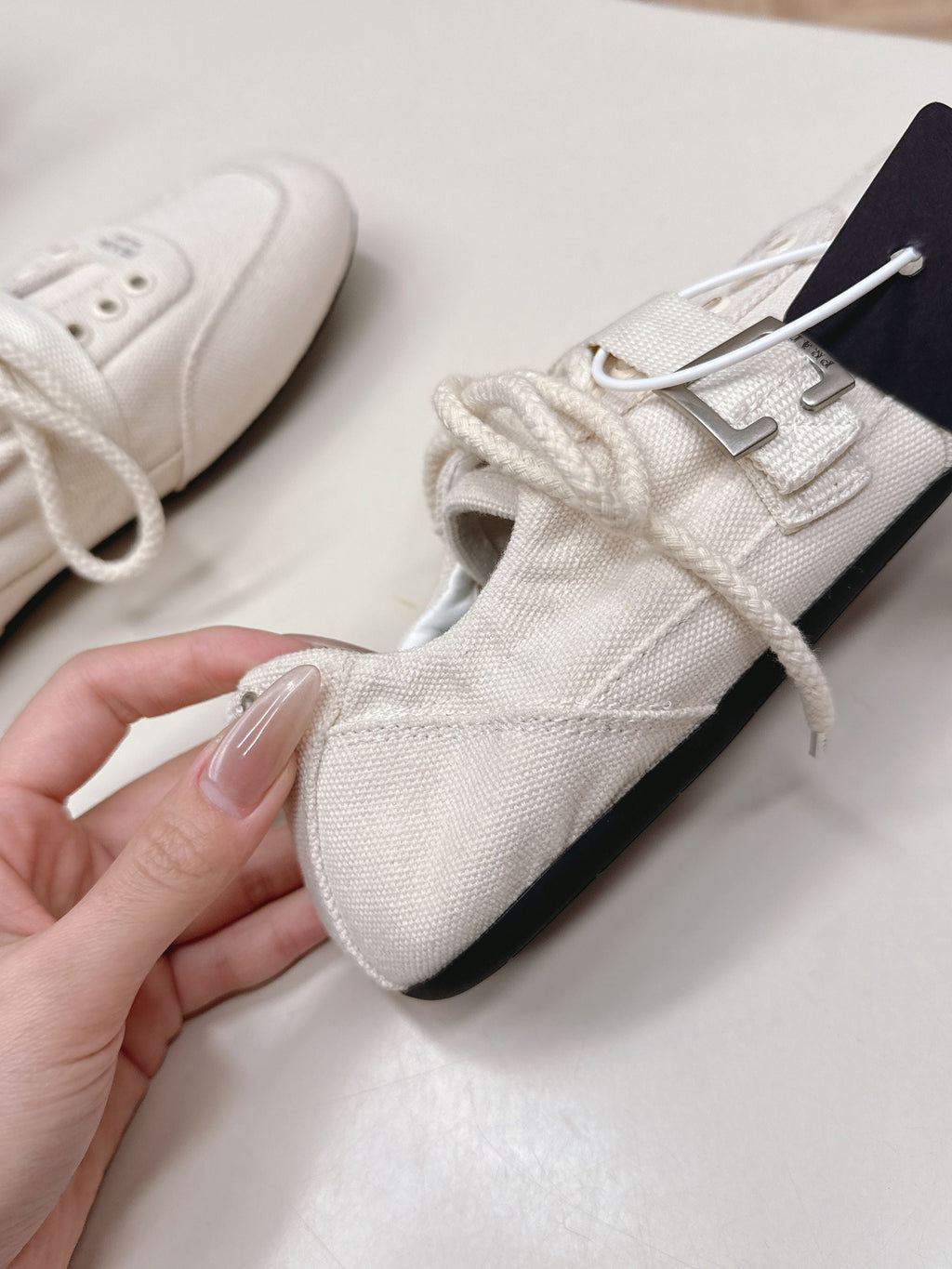PRADA 26S LACE UP MINIMAL SNEAKERS IN WHITE CANVAS