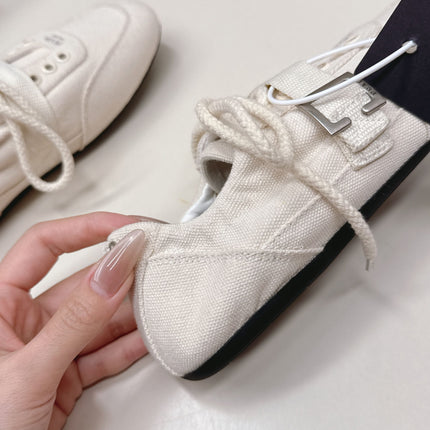 PRADA 26S LACE UP MINIMAL SNEAKERS IN WHITE CANVAS