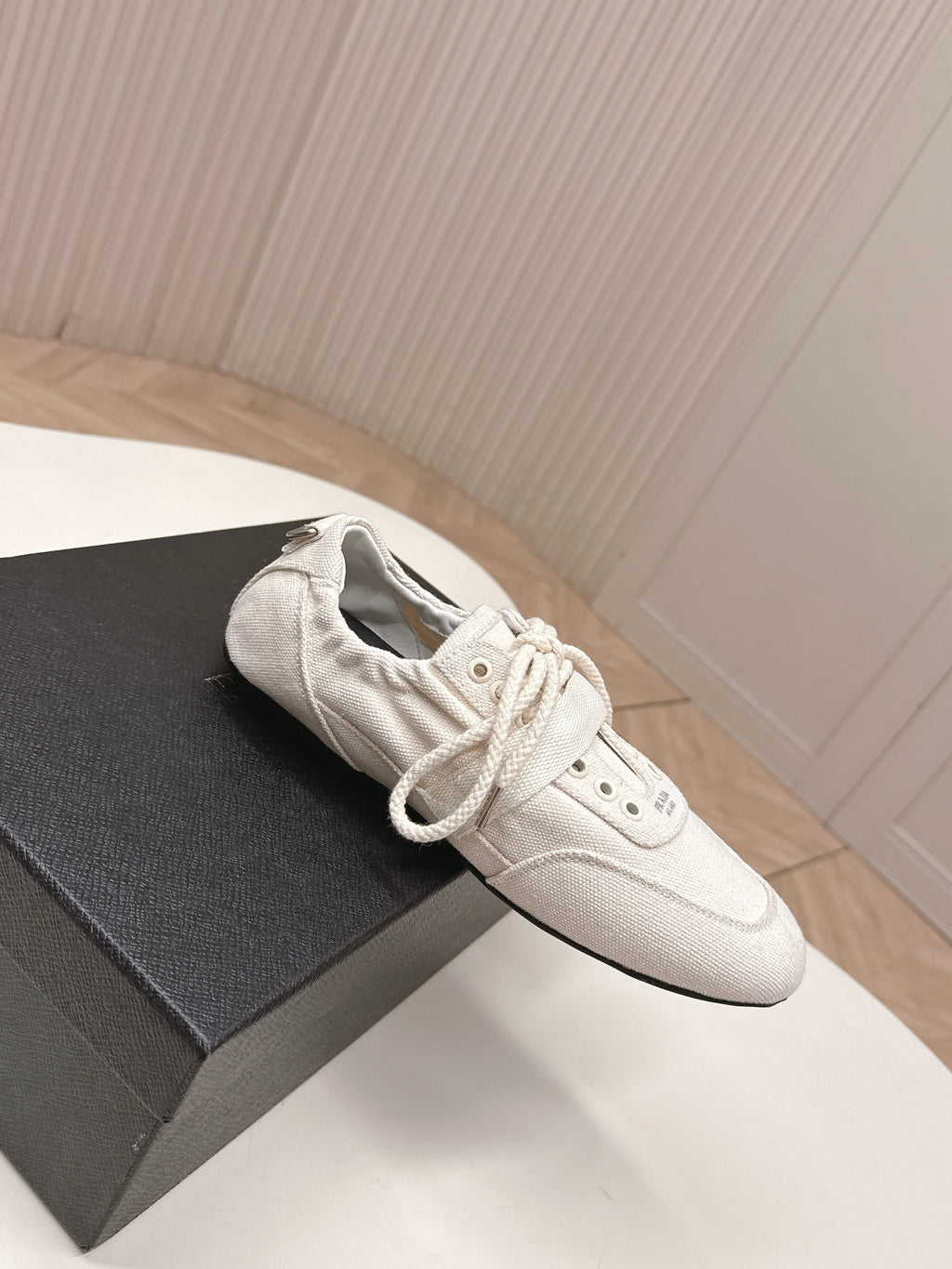 PRADA 26S LACE UP MINIMAL SNEAKERS IN WHITE CANVAS