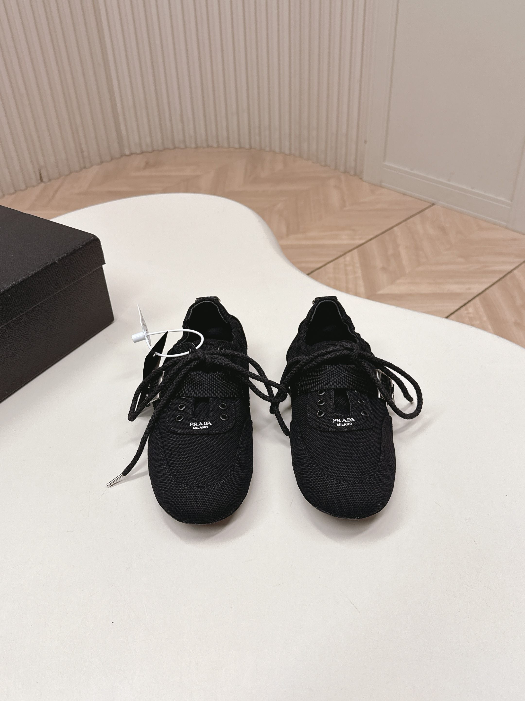 PRADA 26S LACE UP MINIMAL SNEAKERS IN BLACK CANVAS