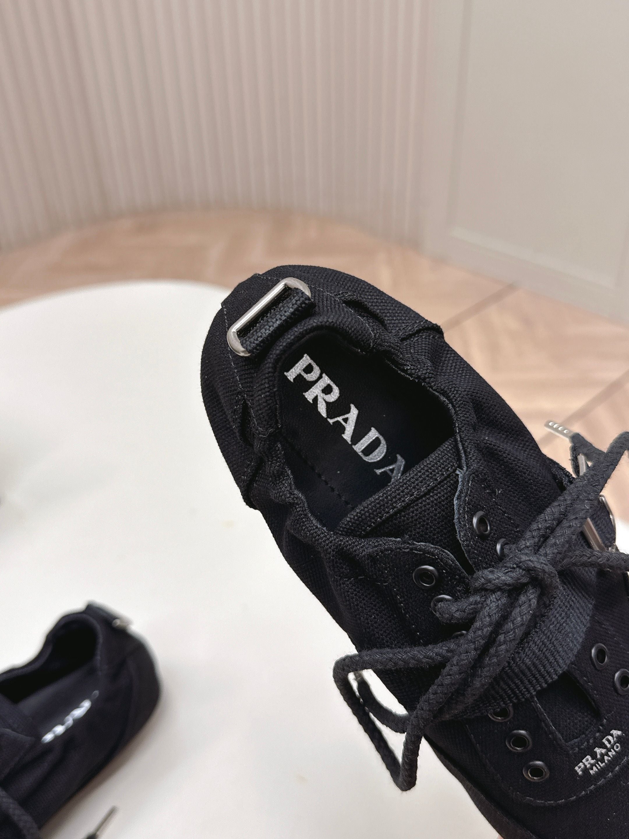 PRADA 26S LACE UP MINIMAL SNEAKERS IN BLACK CANVAS