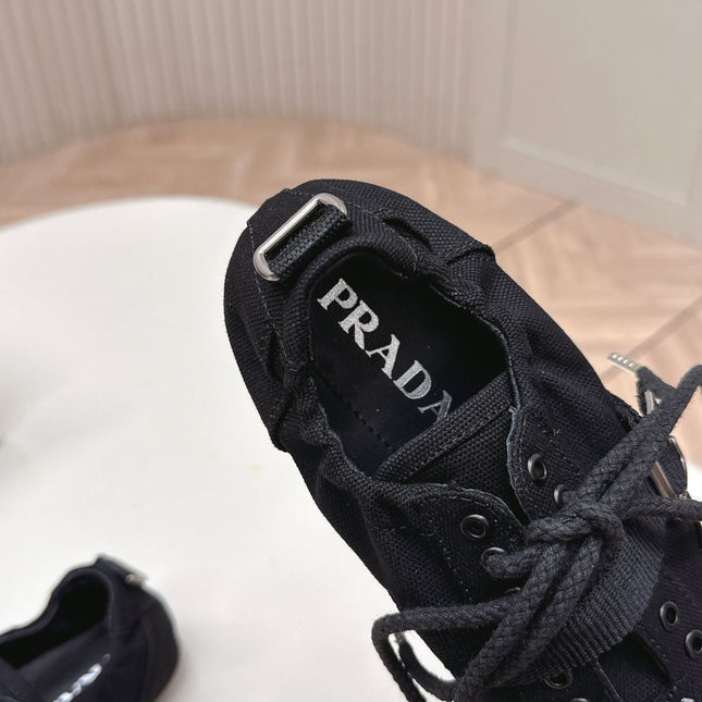 PRADA 26S LACE UP MINIMAL SNEAKERS IN BLACK CANVAS