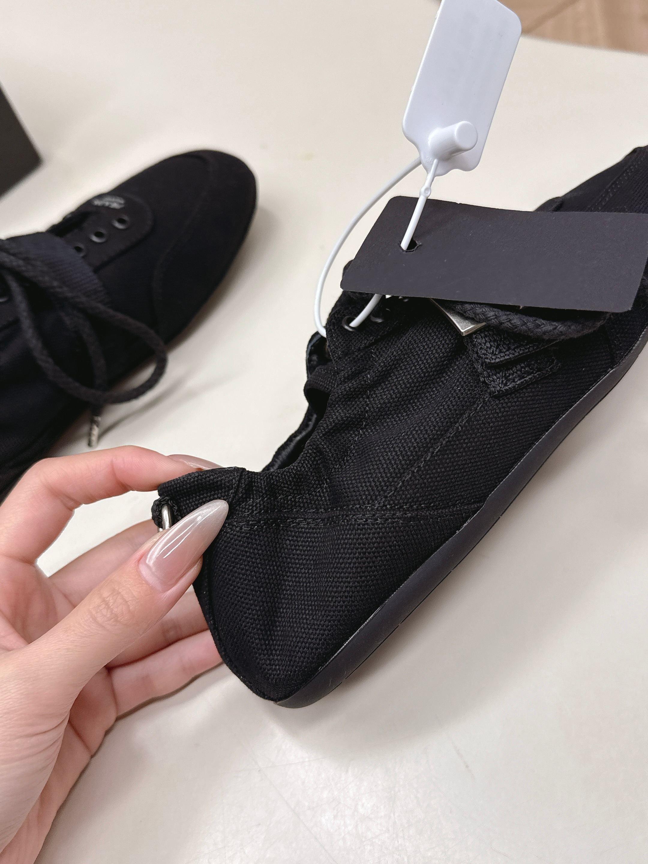 PRADA 26S LACE UP MINIMAL SNEAKERS IN BLACK CANVAS