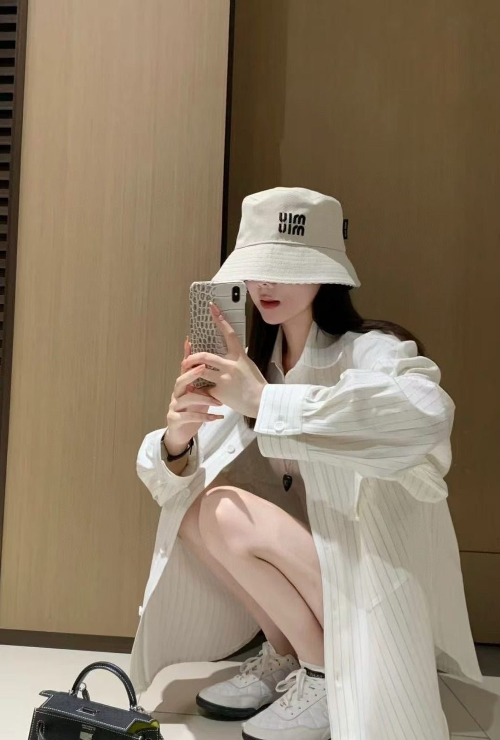 MIUMIU CLASSIC REVERSIBLE BUCKET HAT IN LIGHT BEIGE AND BLACK FABRIC