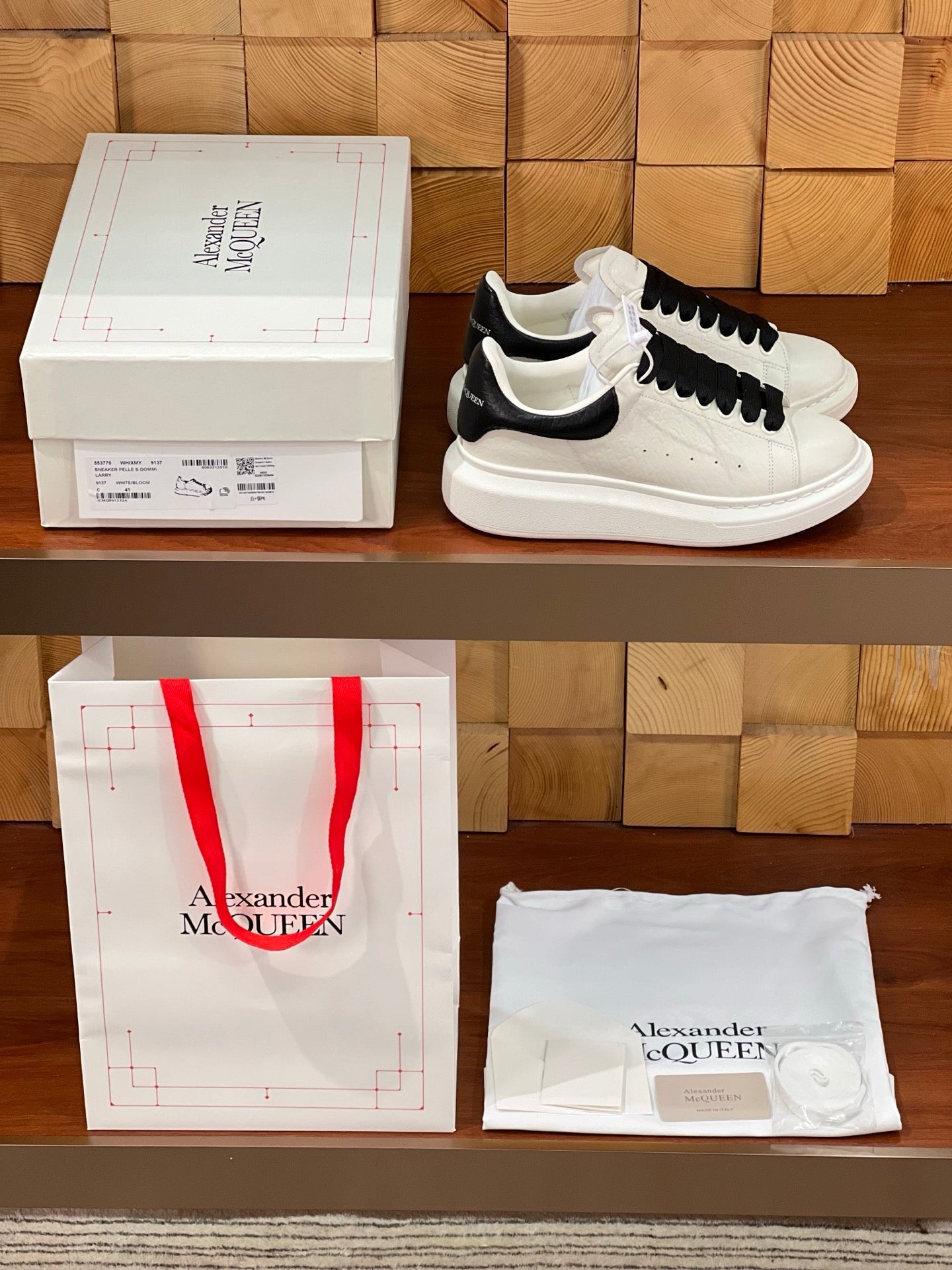 OVERSIZED SNEAKERS IN WHITE CALFSKIN BLACK HEEL BLACK LACES
