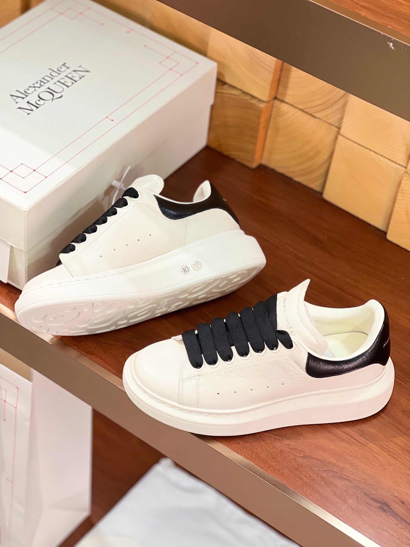 OVERSIZED SNEAKERS IN WHITE CALFSKIN BLACK HEEL BLACK LACES