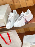 OVERSIZED SNEAKERS IN WHITE CALFSKIN CARTOON FIGURE BLACK TRIM LACES
