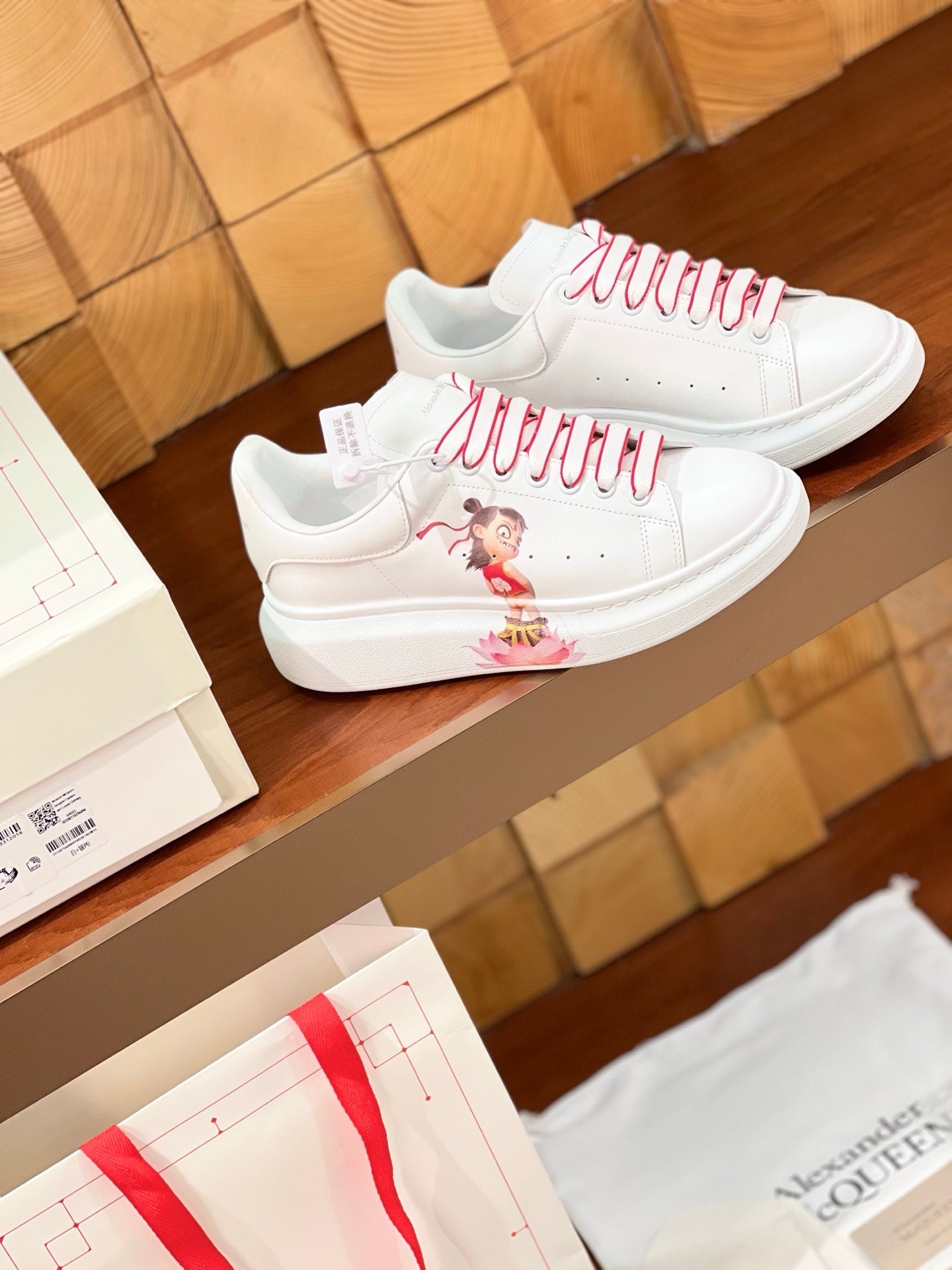 OVERSIZED SNEAKERS IN WHITE CALFSKIN WITH CARTOON FIGURE