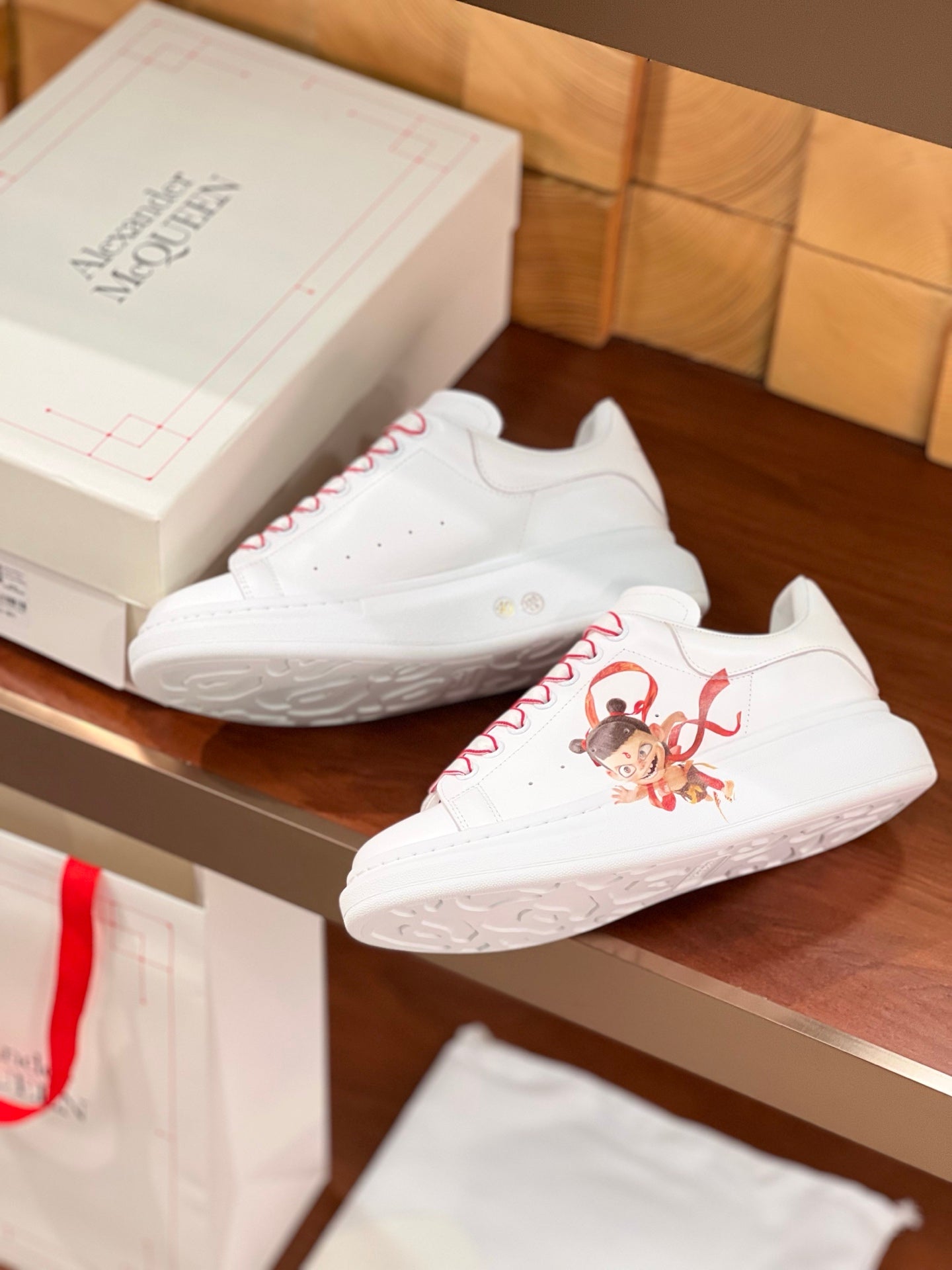 OVERSIZED SNEAKERS IN WHITE CALFSKIN WITH CARTOON FIGURE