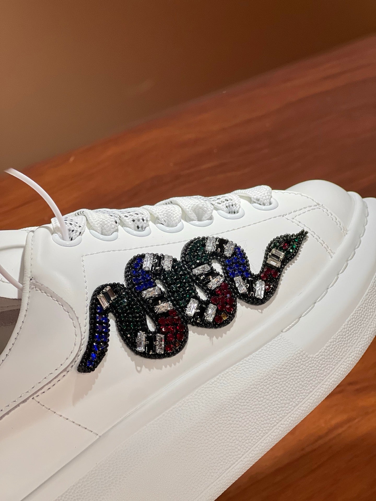 OVERSIZED SNEAKERS IN WHITE CALFSKIN EMBROIDERED MULTICOLOR SNAKE