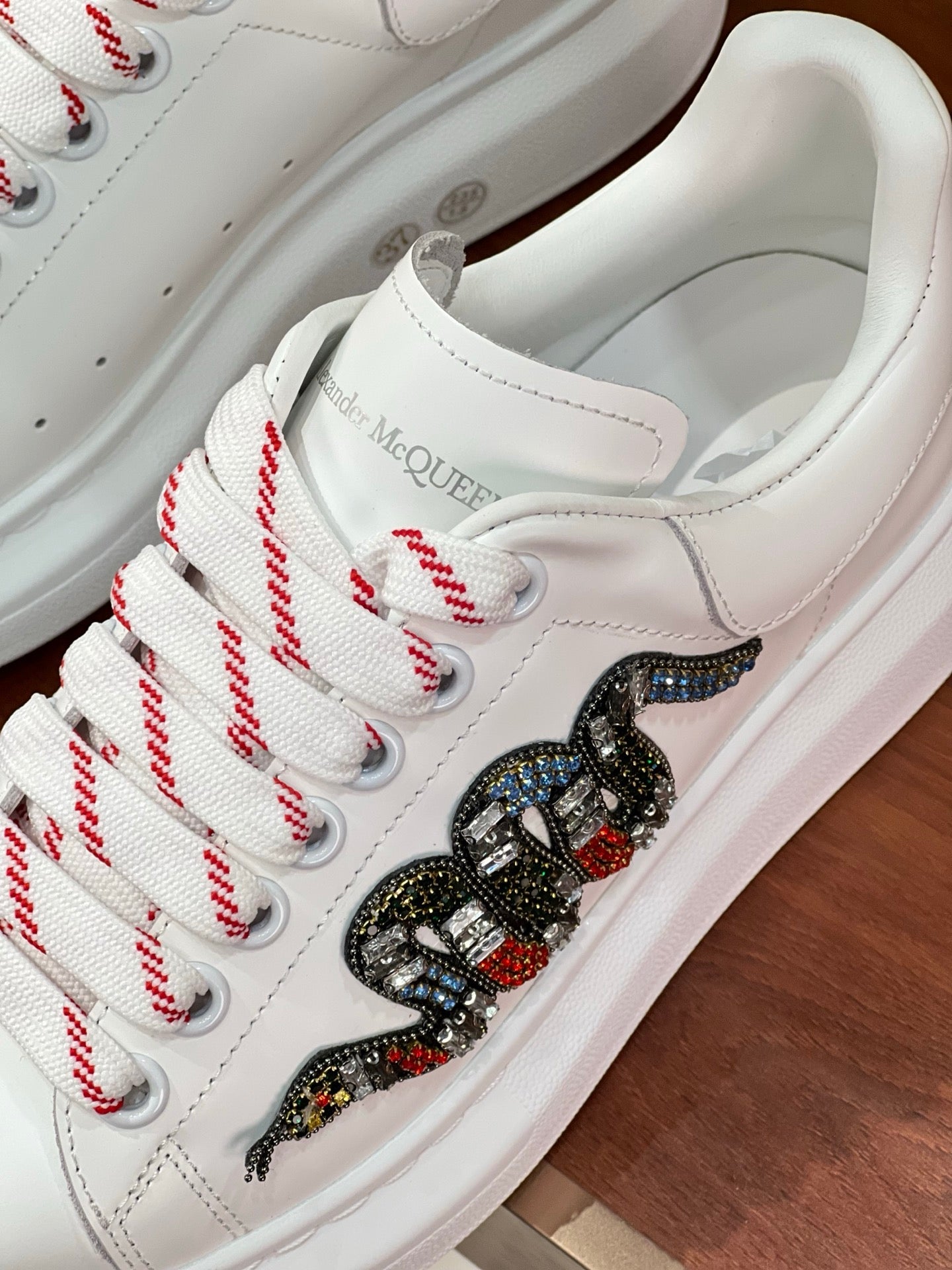 OVERSIZED SNEAKERS IN WHITE CALFSKIN EMBROIDERED CRYSTAL SNAKE